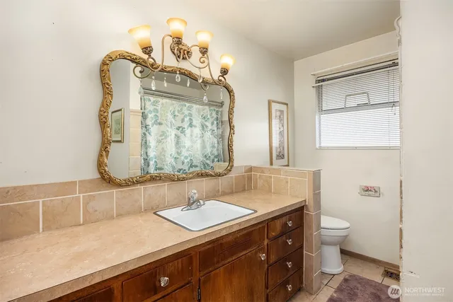 a bathroom with a sink double vanity and a mirror