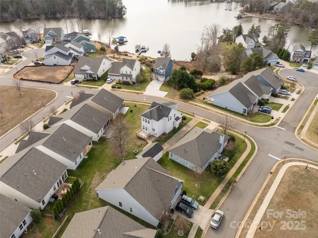 an aerial view of a house with outdoor space