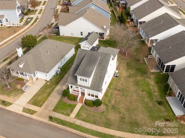 an aerial view of a house with a swimming pool