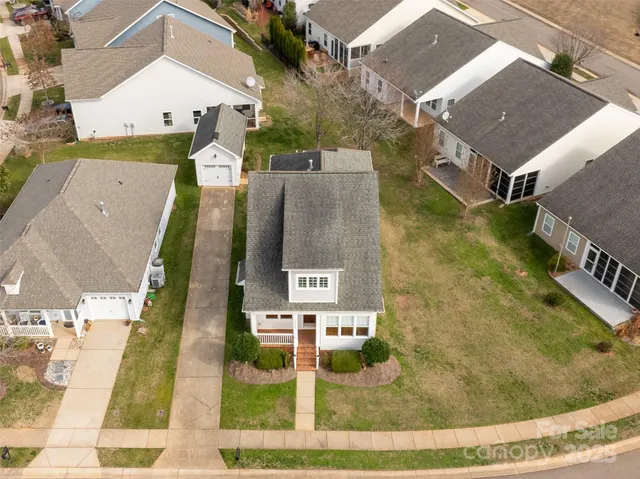 an aerial view of a house with outdoor space