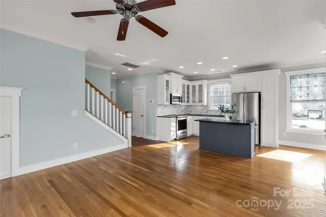 a view of kitchen with wooden floor and window