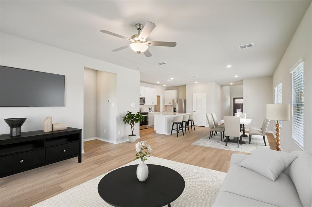 1712 Arches Road Anna, TX 75409 - Photo 11 of 37 a living room with furniture kitchen view and a chandelier