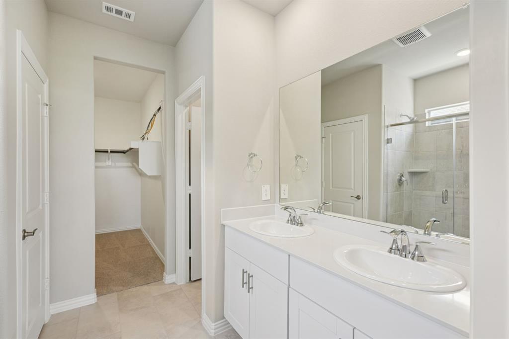 1712 Arches Road Anna, TX 75409 - Photo 20 of 37 a bathroom with a double vanity sink mirror and double