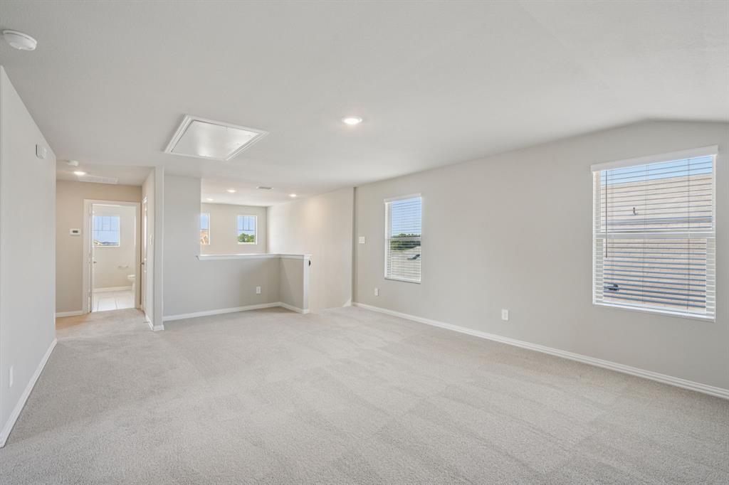 1712 Arches Road Anna, TX 75409 - Photo 28 of 37 a view of an empty room with a window and closet area