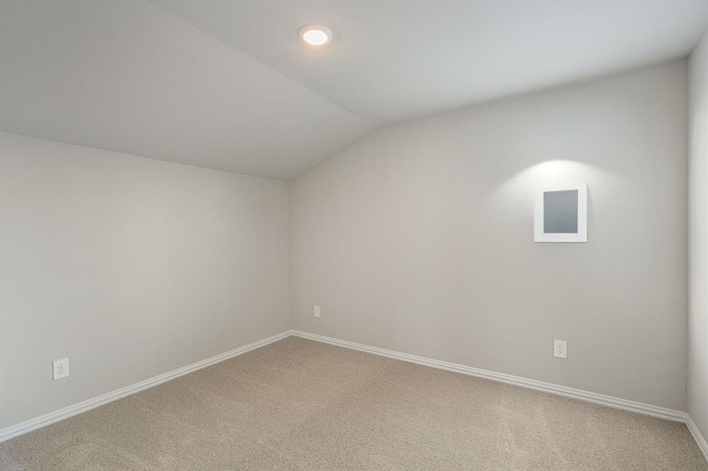 1712 Arches Road Anna, TX 75409 - Photo 30 of 37 an empty room with a empty space and window