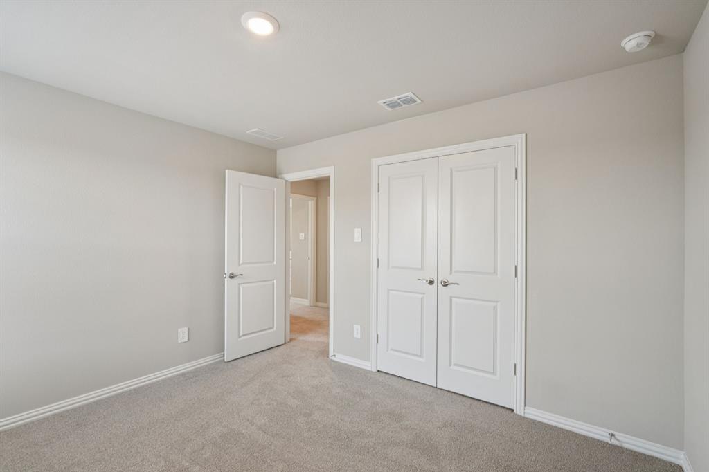 1712 Arches Road Anna, TX 75409 - Photo 32 of 37 a view of an empty room and closet area