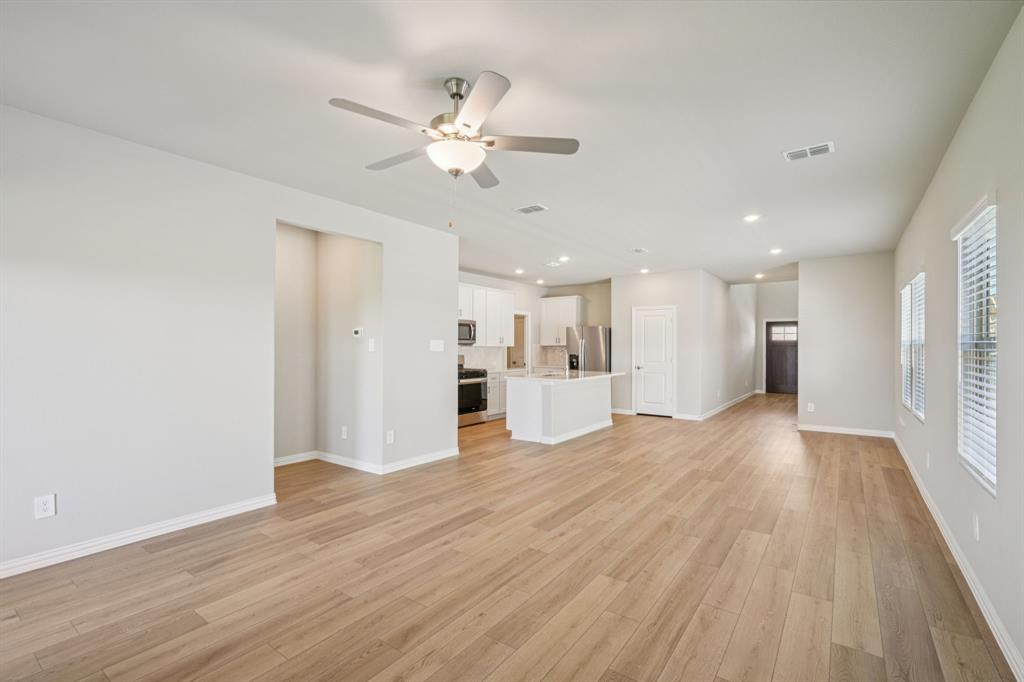 1712 Arches Road Anna, TX 75409 - Photo 10 of 37 a view of a kitchen with a sink and a refrigerator