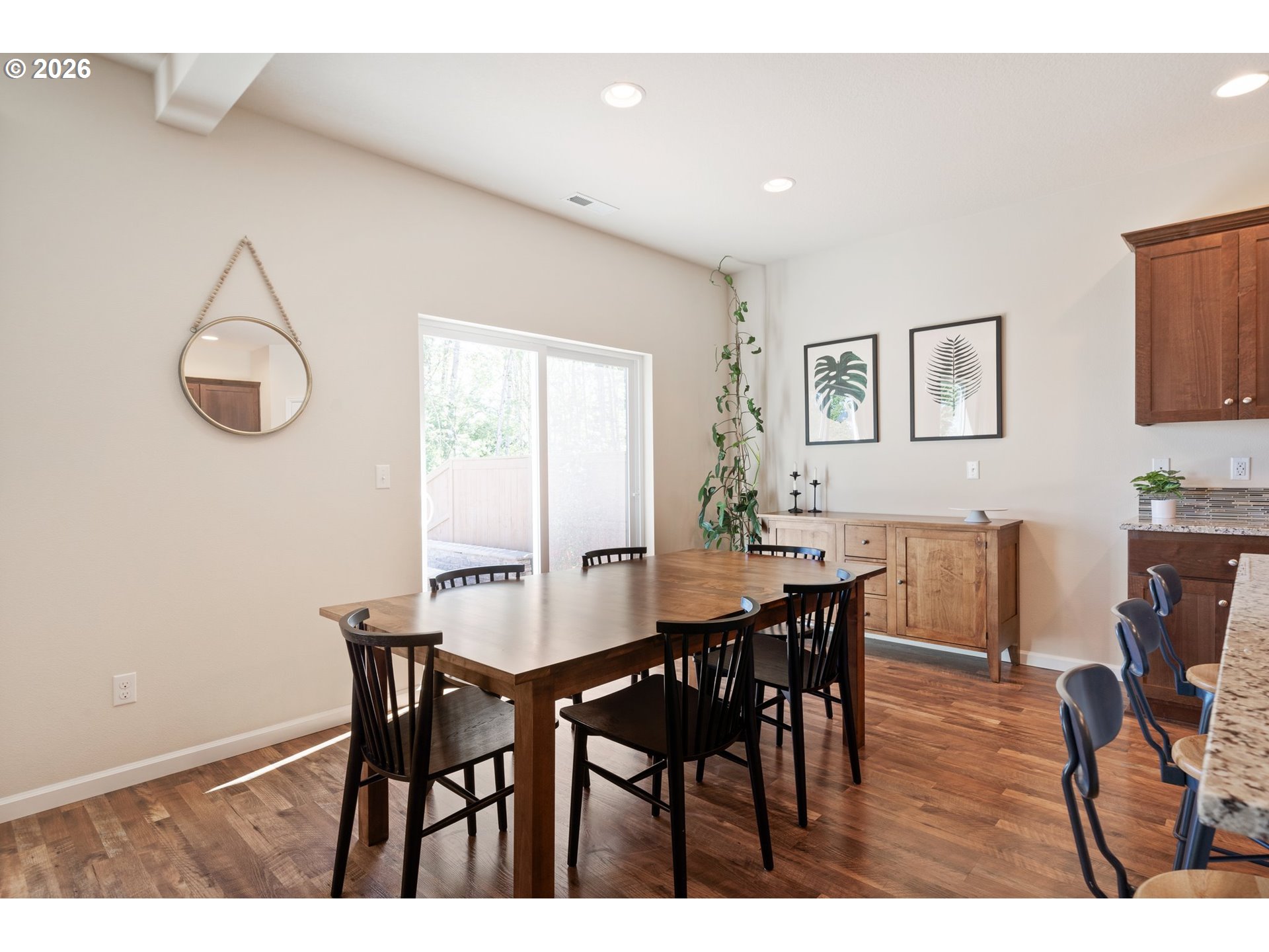 16185 Northwest Liberty Street Portland, OR 97229 - Photo 11 of 33 a view of a dining room with furniture and wooden floor