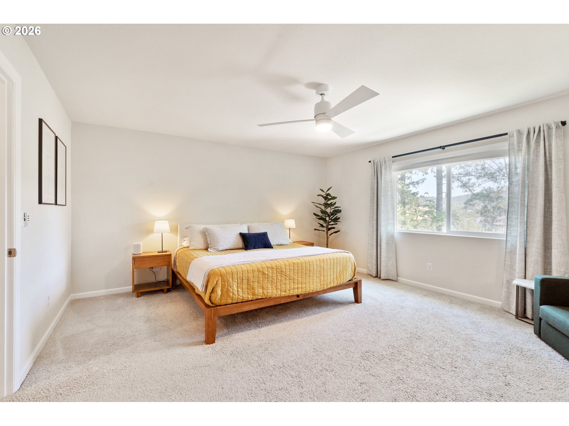 16185 Northwest Liberty Street Portland, OR 97229 - Photo 16 of 33 a spacious bedroom with a bed and window