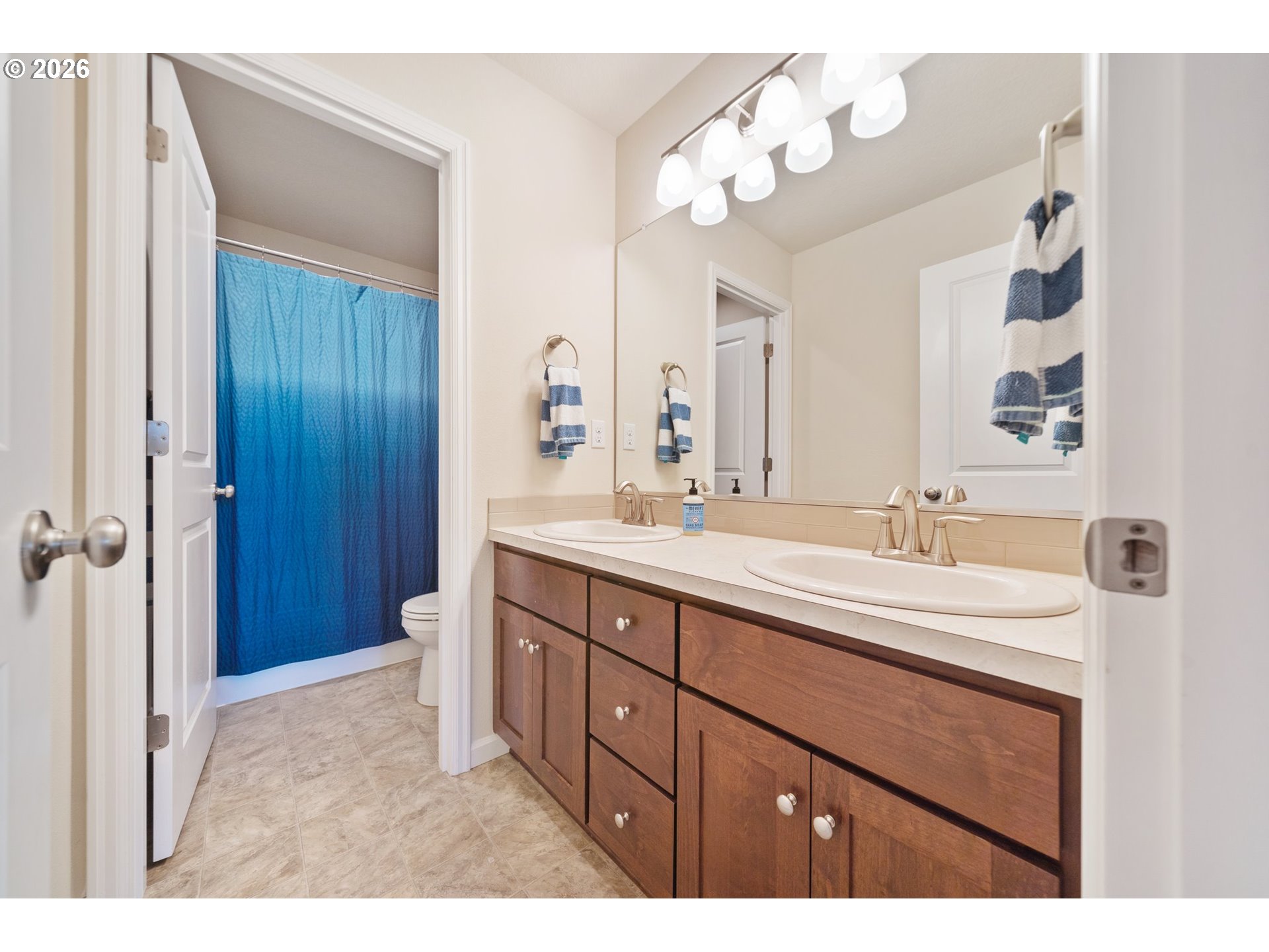16185 Northwest Liberty Street Portland, OR 97229 - Photo 21 of 33 a bathroom with a sink vanity granite and a mirror