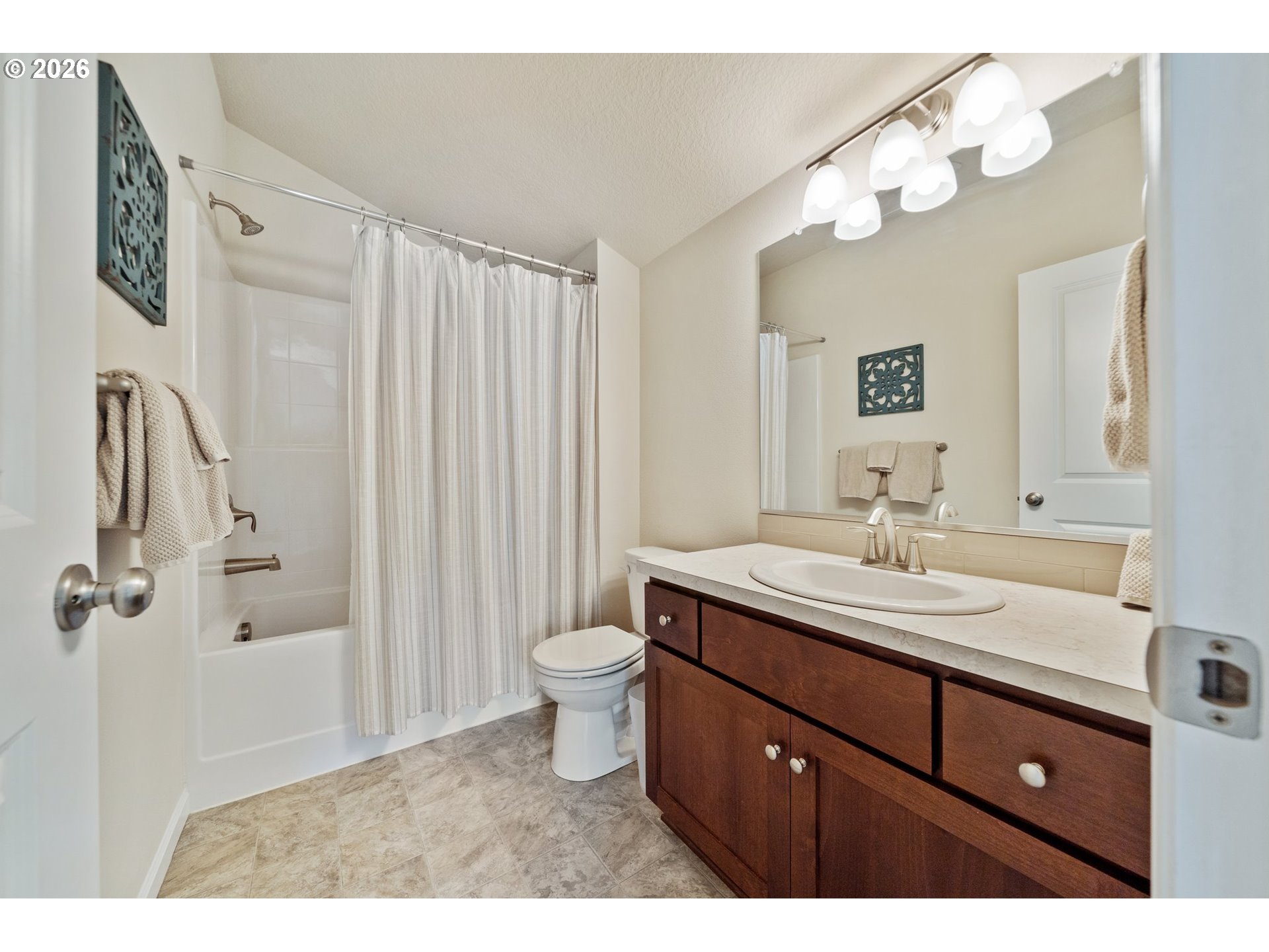16185 Northwest Liberty Street Portland, OR 97229 - Photo 23 of 33 a bathroom with a sink a toilet and a mirror