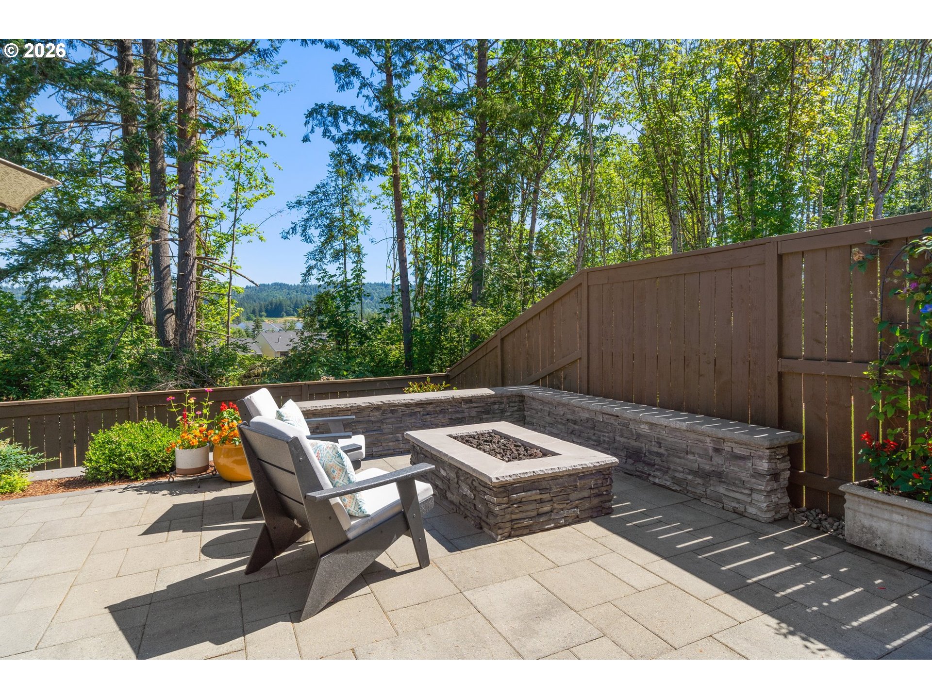 16185 Northwest Liberty Street Portland, OR 97229 - Photo 28 of 33 a backyard of a house with outdoor seating