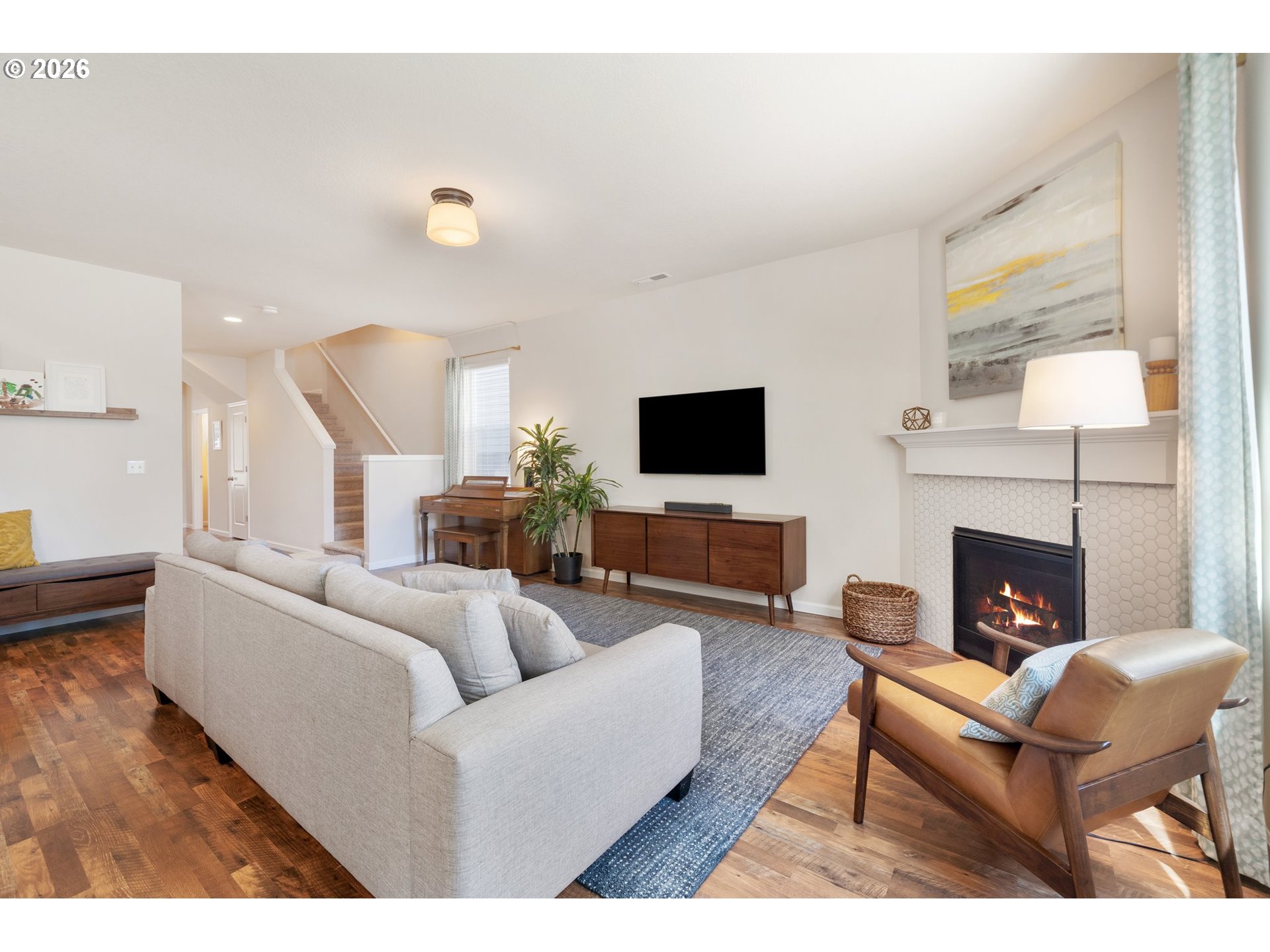 16185 Northwest Liberty Street Portland, OR 97229 - Photo 4 of 33 a living room with furniture a fireplace and a flat screen tv