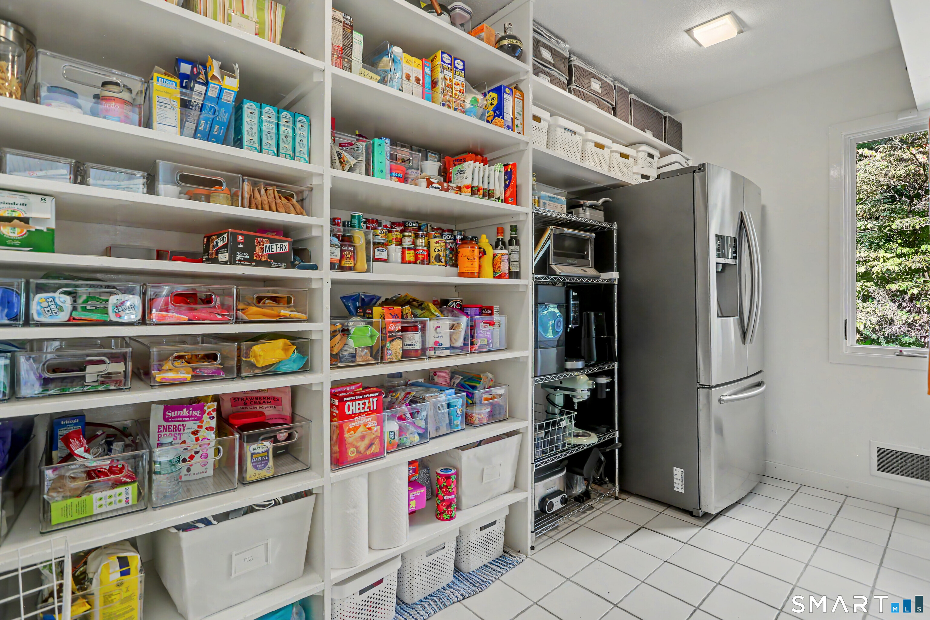 9 Autumn Ridge Road Weston, CT 06883 - Photo 17 of 40 The walk-in pantry is just off the laundry/mudroom, and offers ample storage and shelving.