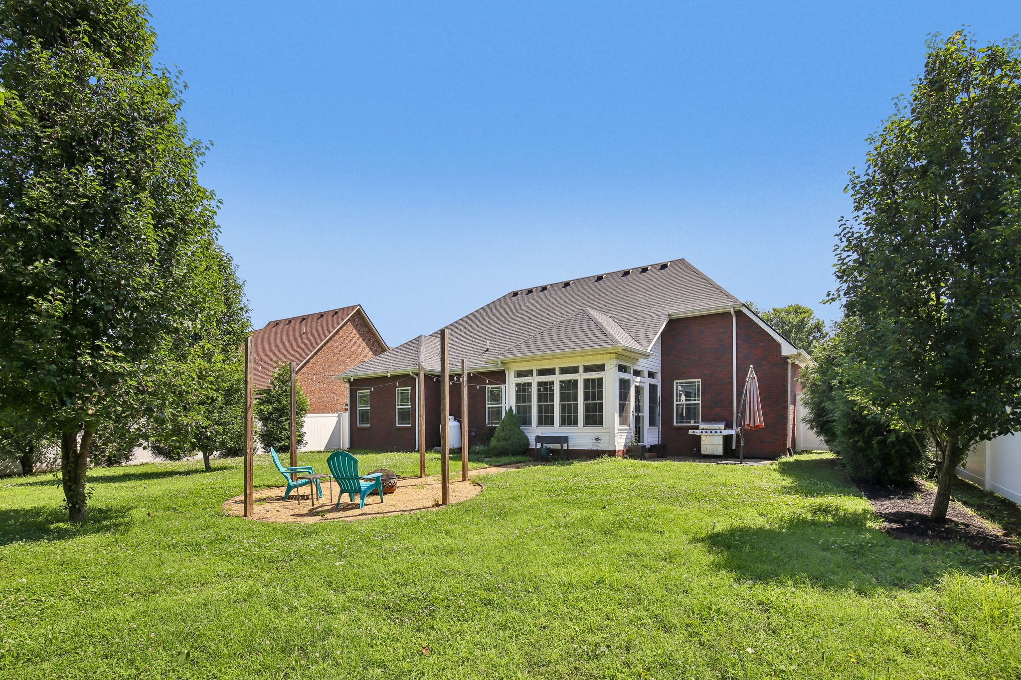 316 Amazonway Ridge Lascassas, TN 37085 - Photo 33 of 36 a front view of a house with a yard table and chairs