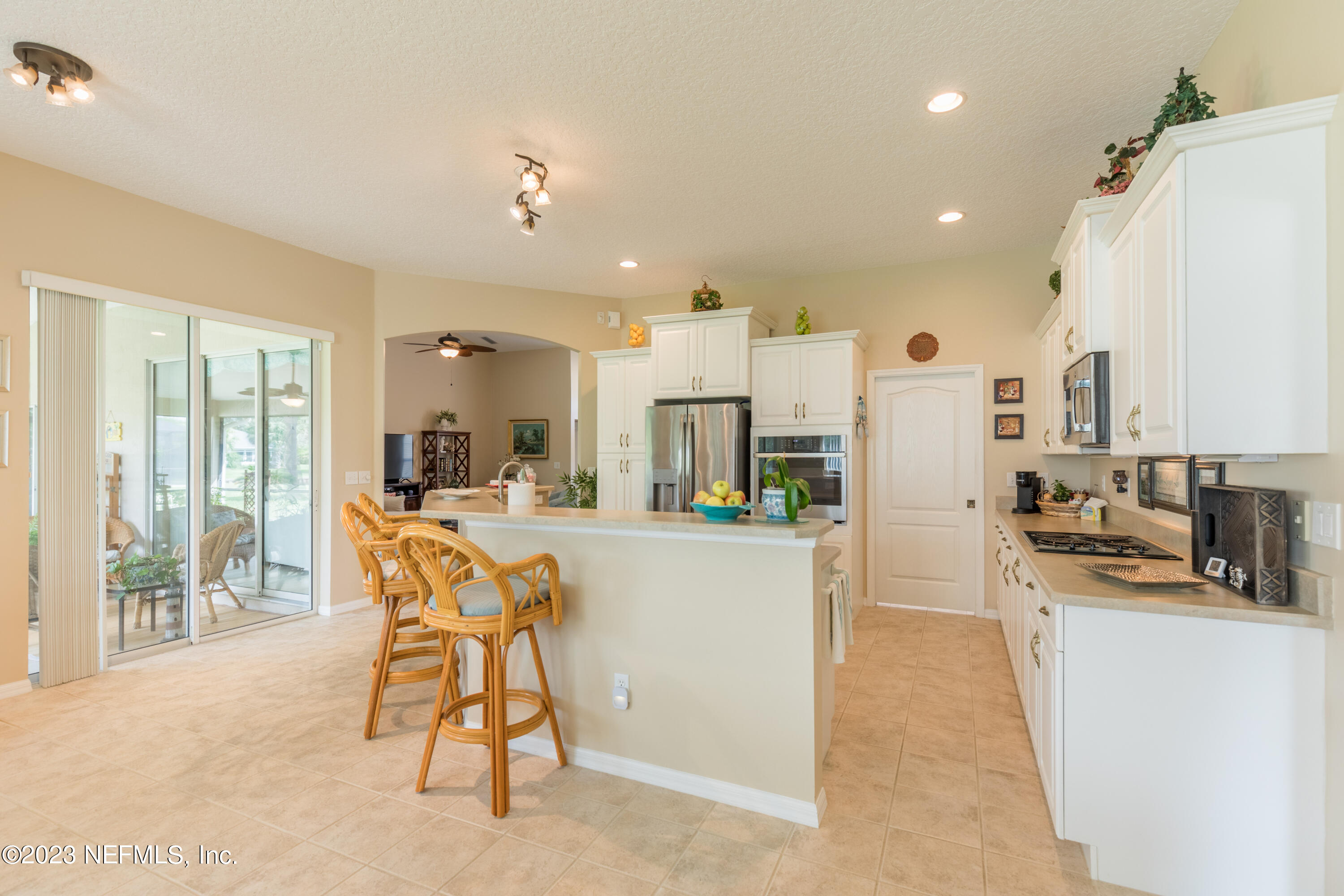 293 San Nicolas Way St. Augustine, FL 32080 - Photo 14 of 51 a view of a kitchen with furniture and a refrigerator