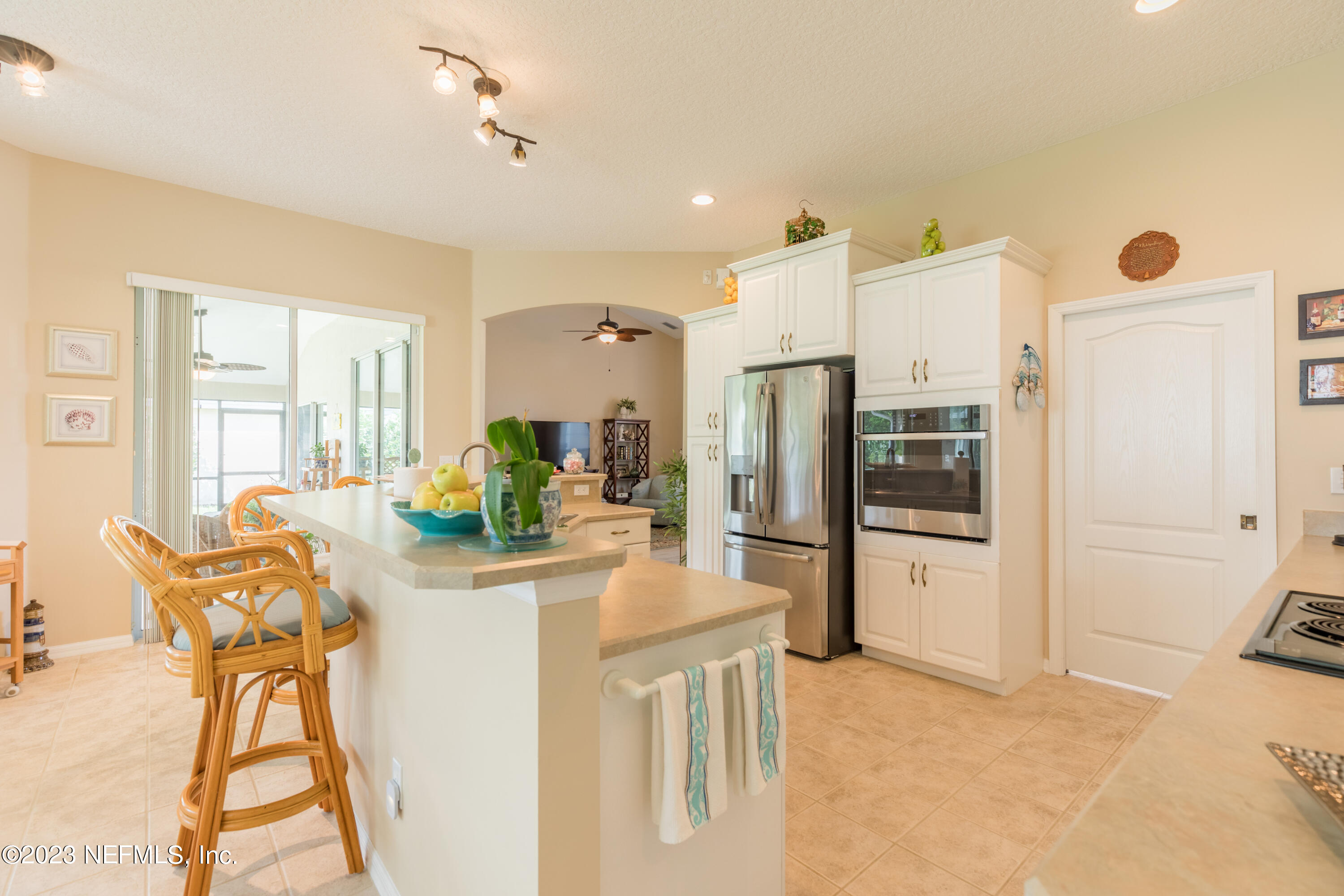 293 San Nicolas Way St. Augustine, FL 32080 - Photo 15 of 51 a kitchen with stainless steel appliances kitchen island granite countertop a refrigerator and cabinets