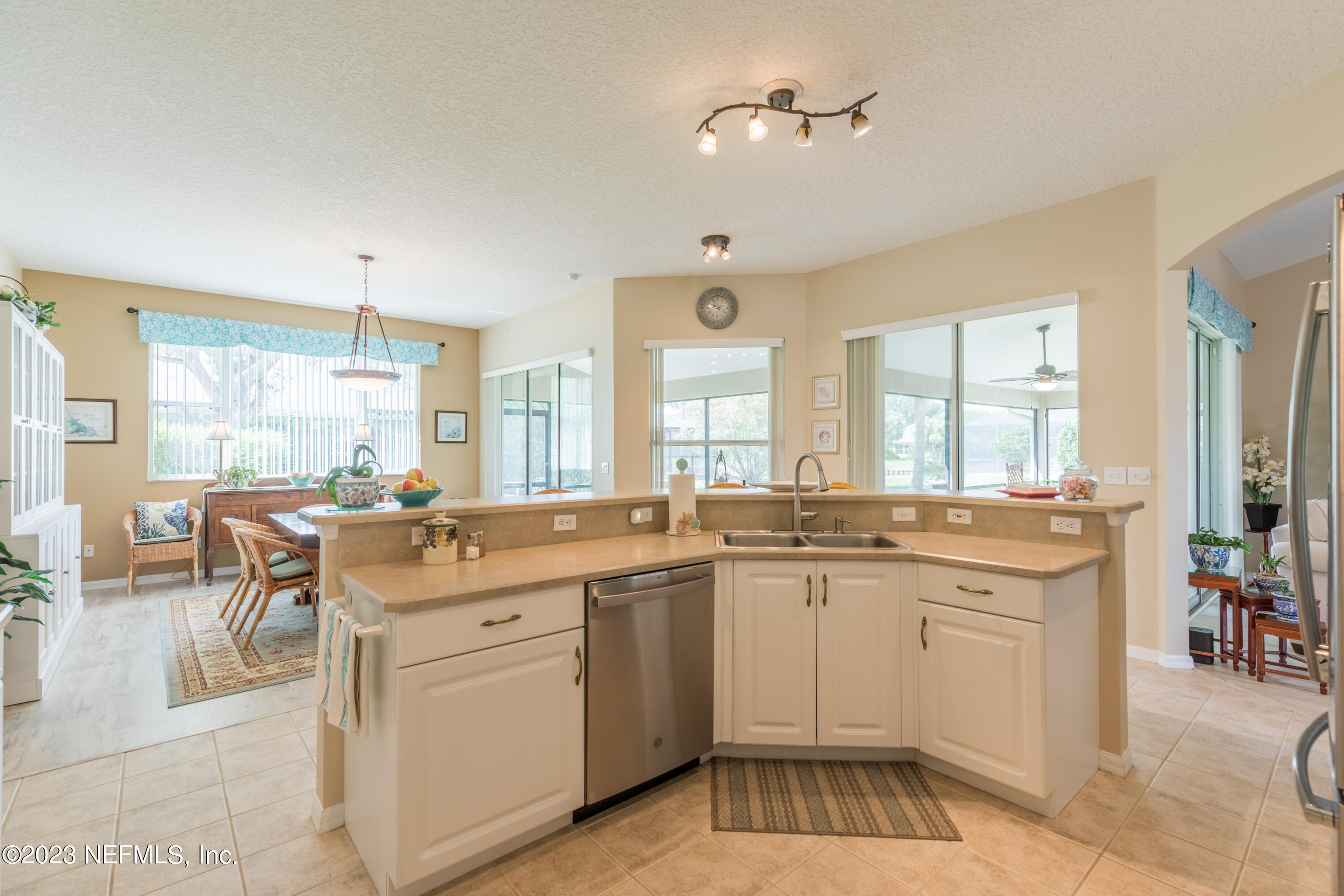 293 San Nicolas Way St. Augustine, FL 32080 - Photo 16 of 51 a large kitchen with a lot of white cabinets and appliances