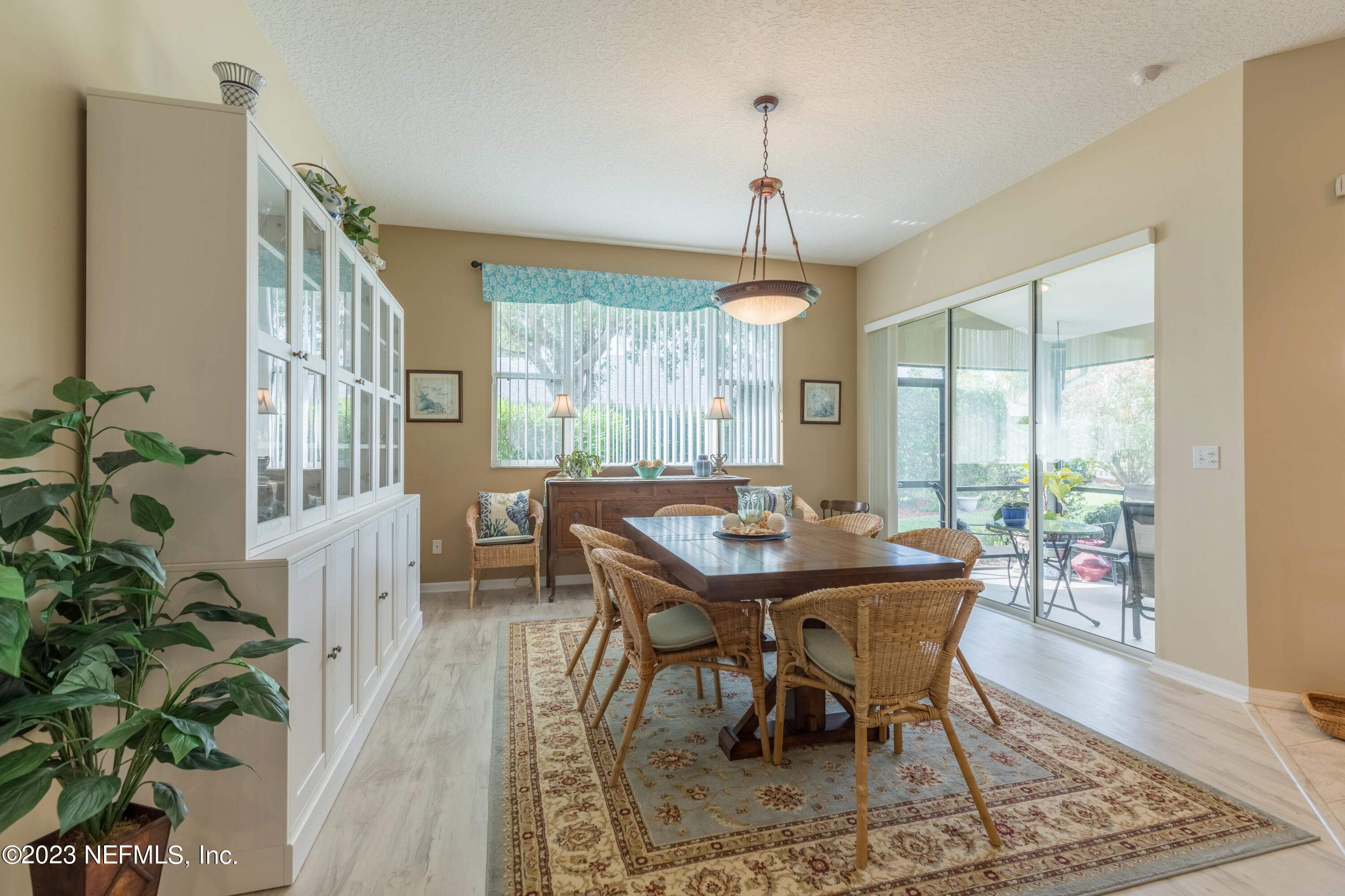 293 San Nicolas Way St. Augustine, FL 32080 - Photo 17 of 51 a view of a dining room with furniture window and wooden floor