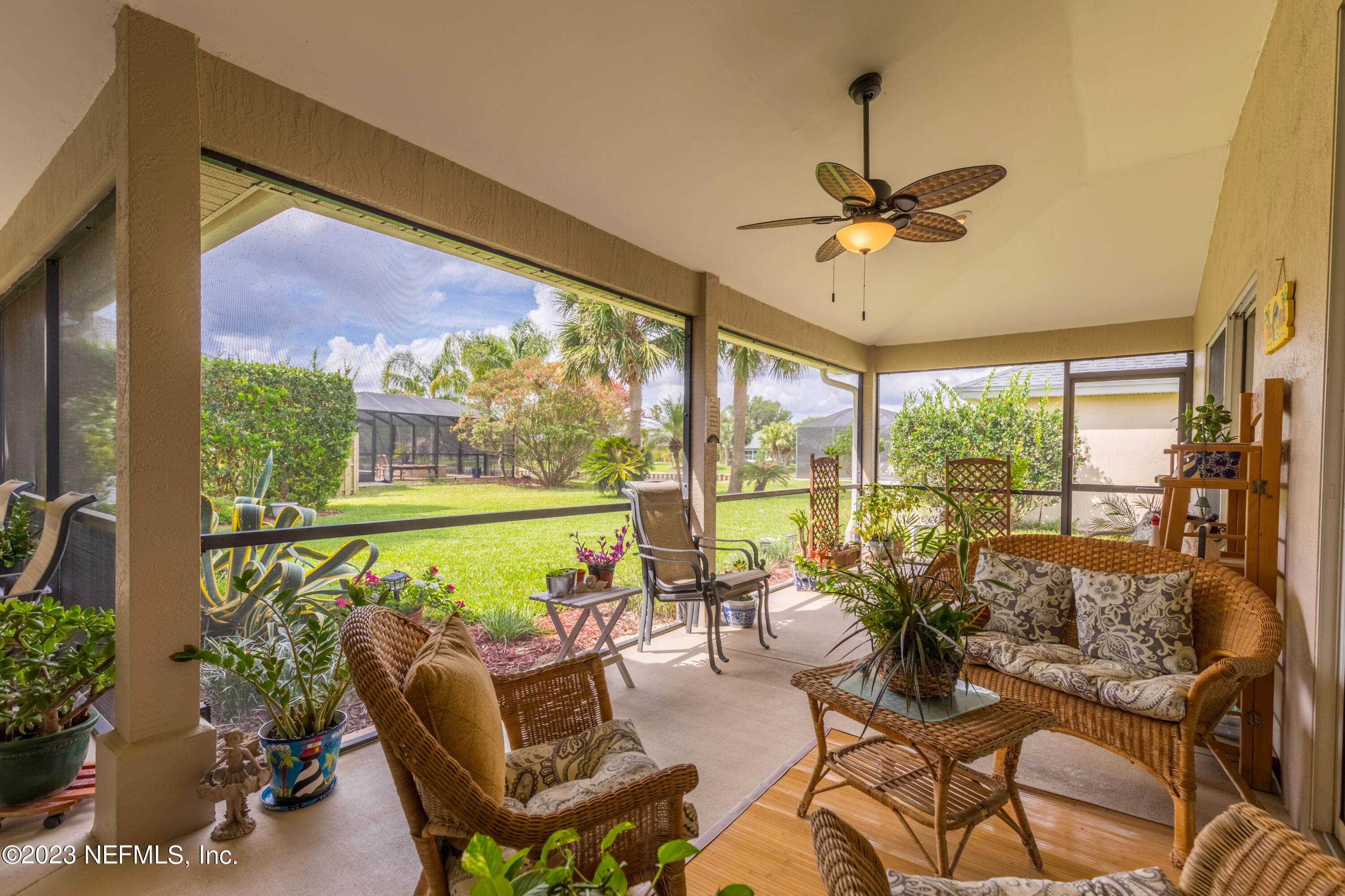 293 San Nicolas Way St. Augustine, FL 32080 - Photo 20 of 51 a living room with patio furniture and a floor to ceiling window
