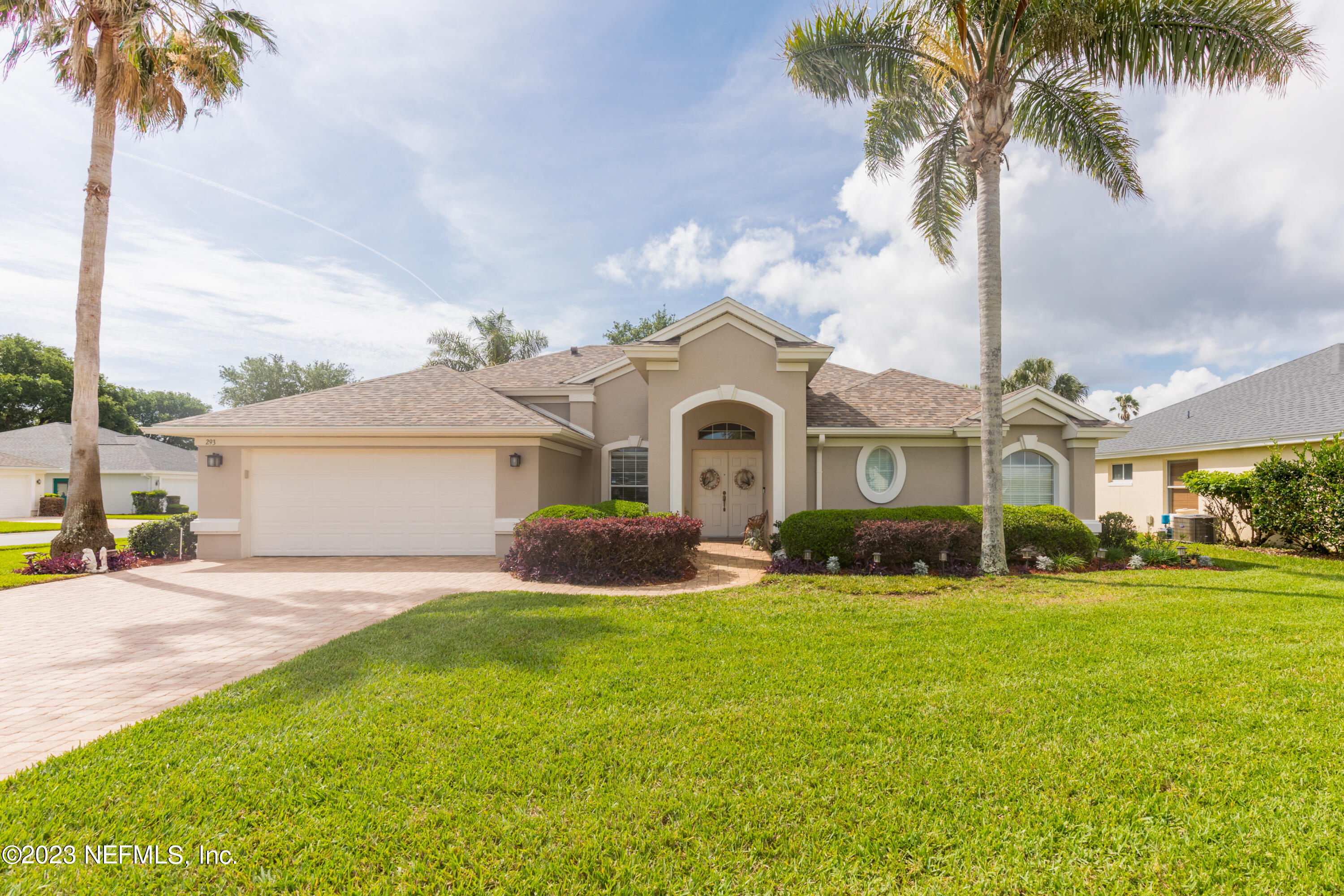 293 San Nicolas Way St. Augustine, FL 32080 - Photo 2 of 51 a front view of a house with yard and green space