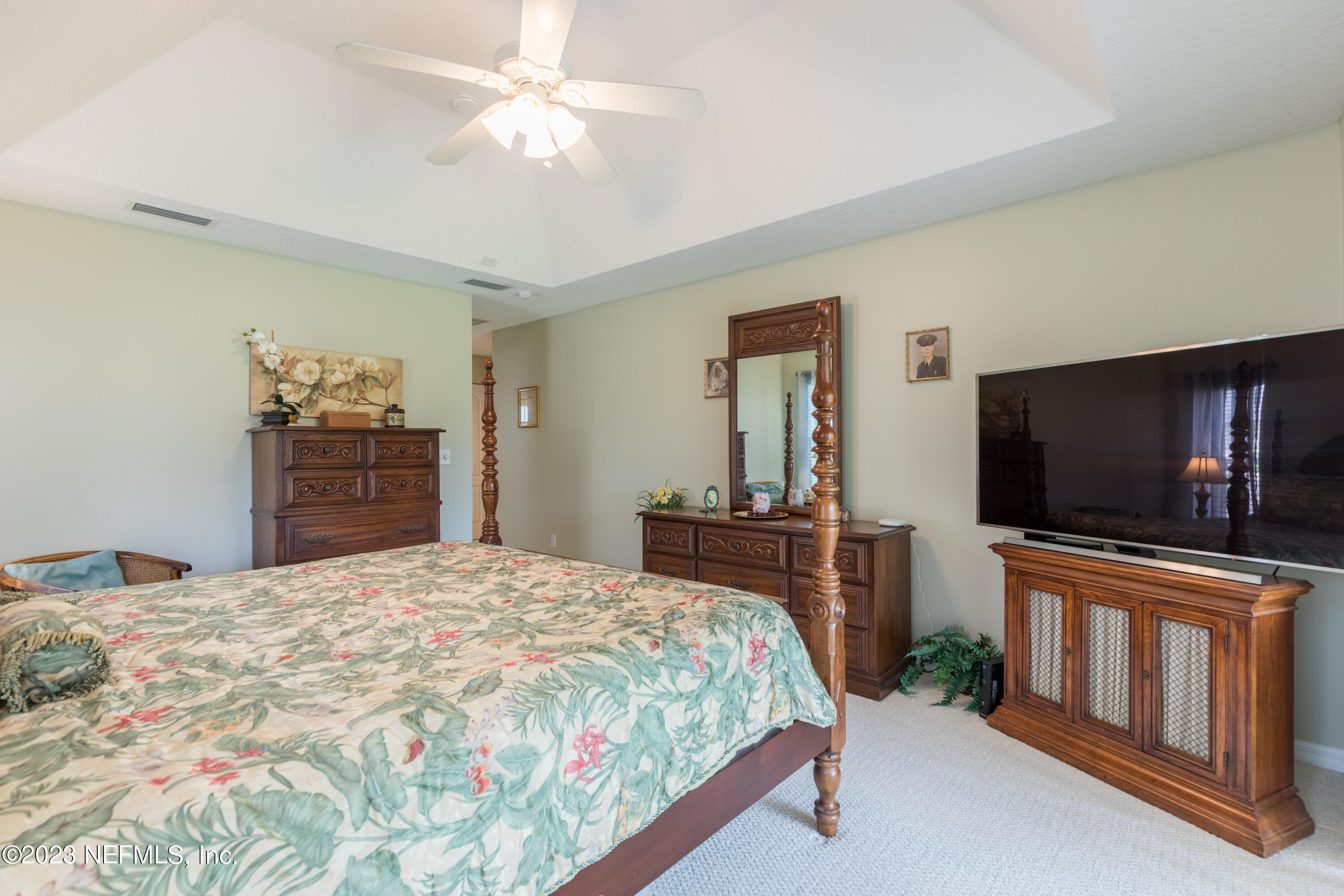 293 San Nicolas Way St. Augustine, FL 32080 - Photo 28 of 51 a bedroom with a bed and a flat screen tv