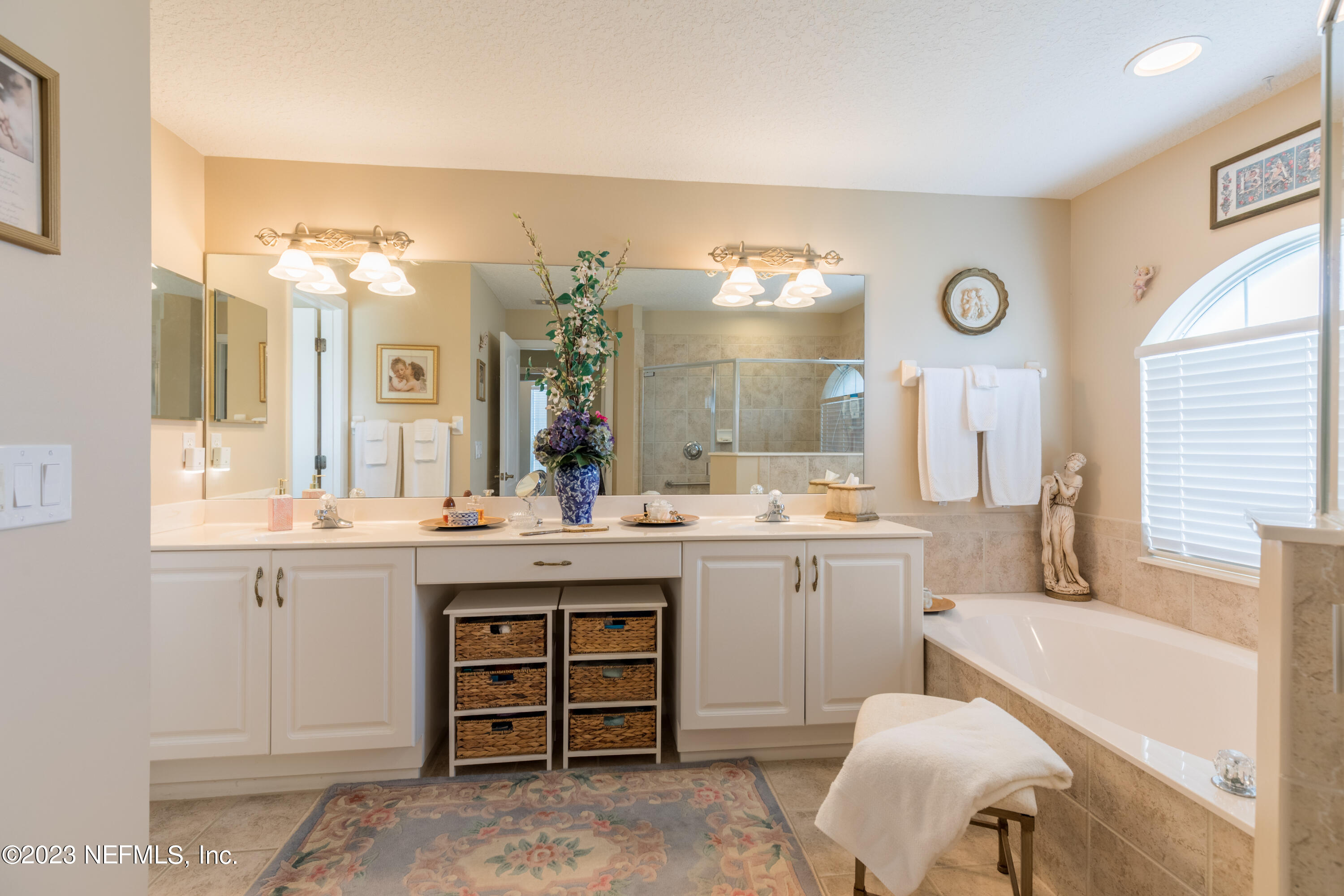 293 San Nicolas Way St. Augustine, FL 32080 - Photo 29 of 51 a spacious bathroom with a granite countertop sink and a mirror