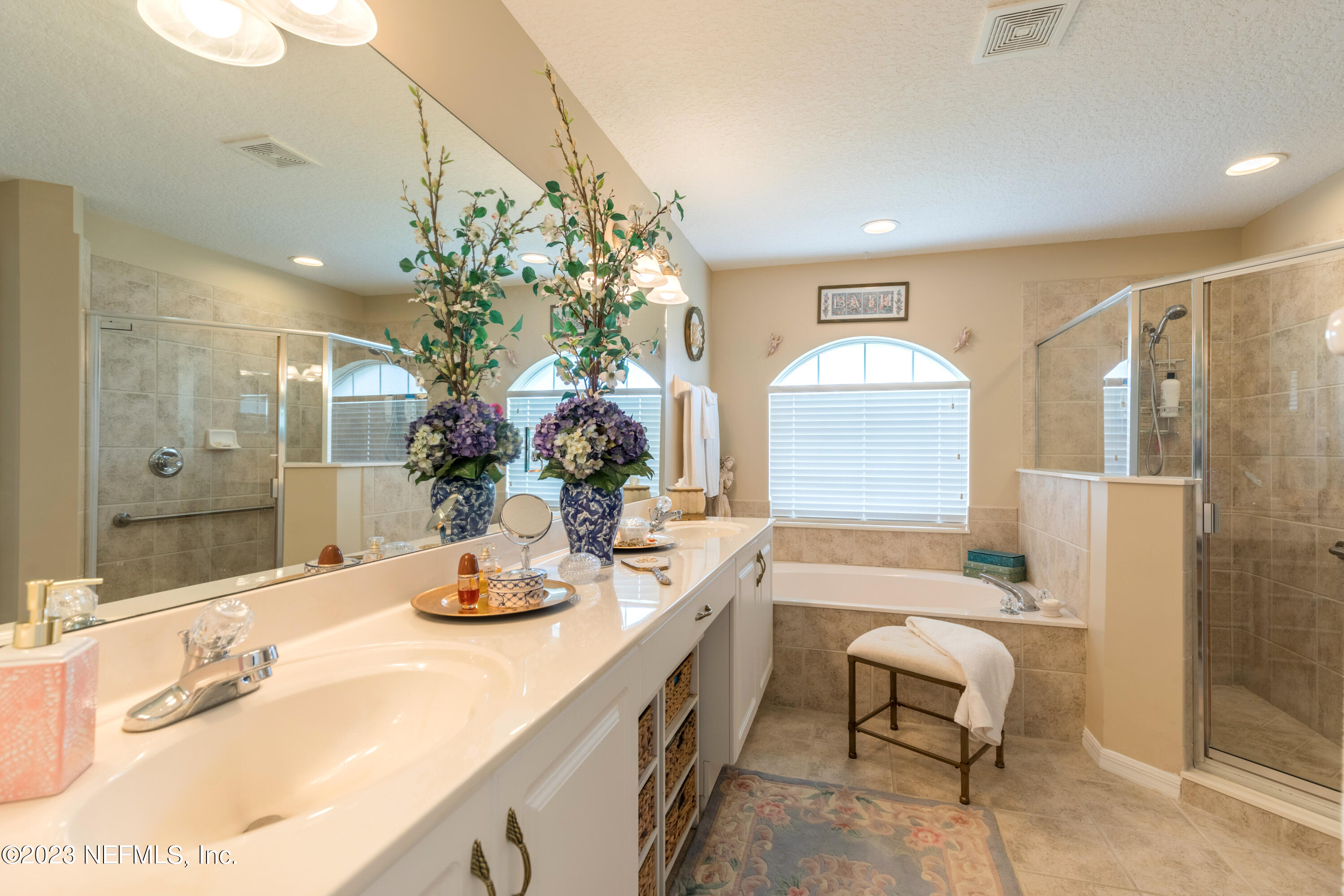 293 San Nicolas Way St. Augustine, FL 32080 - Photo 30 of 51 a bathroom with a granite countertop sink a toilet and shower