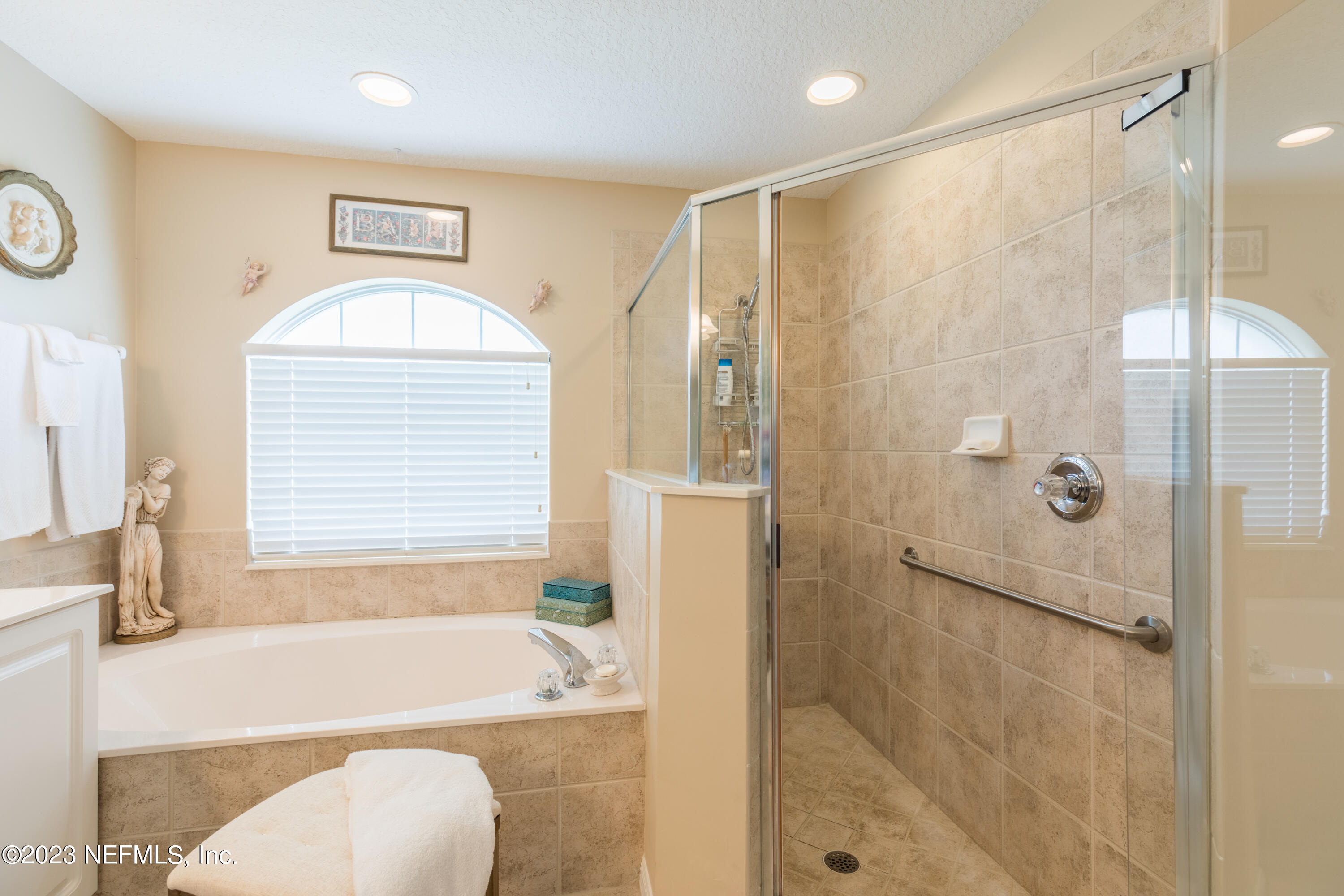 293 San Nicolas Way St. Augustine, FL 32080 - Photo 31 of 51 a bathroom with a tub a sink and a shower