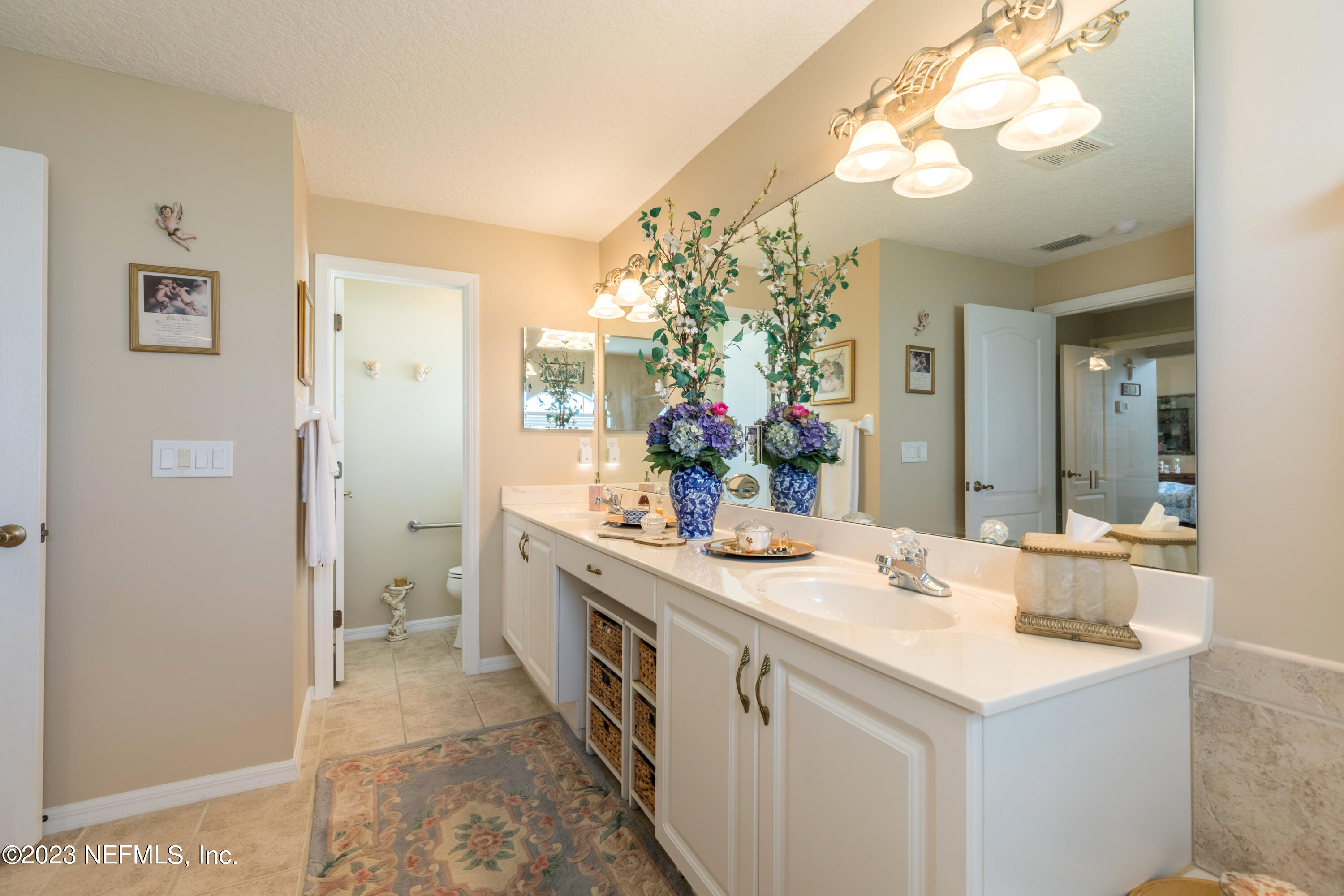 293 San Nicolas Way St. Augustine, FL 32080 - Photo 32 of 51 a bathroom with a sink and a mirror