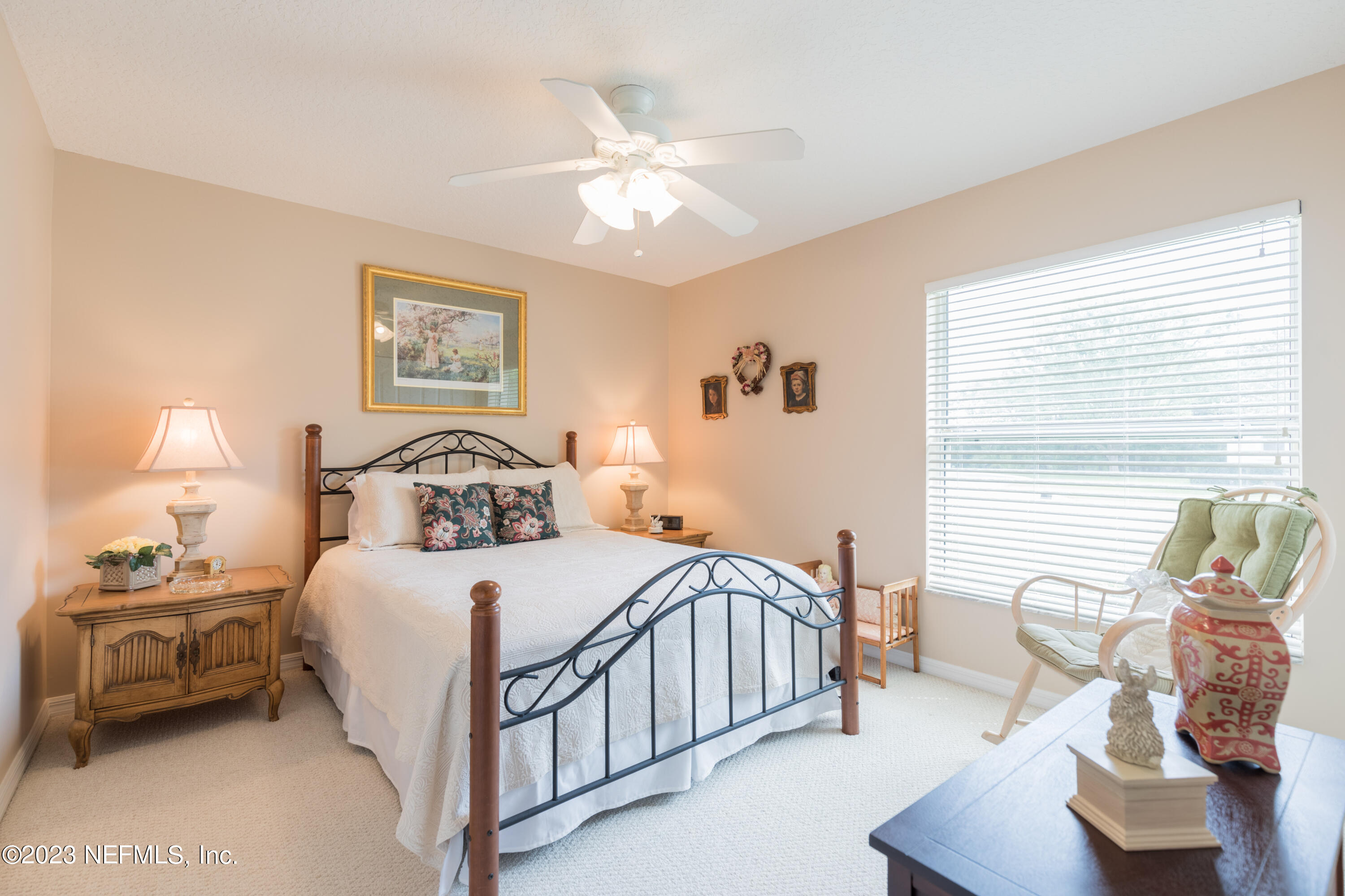 293 San Nicolas Way St. Augustine, FL 32080 - Photo 34 of 51 a bedroom with a bed and a chandelier