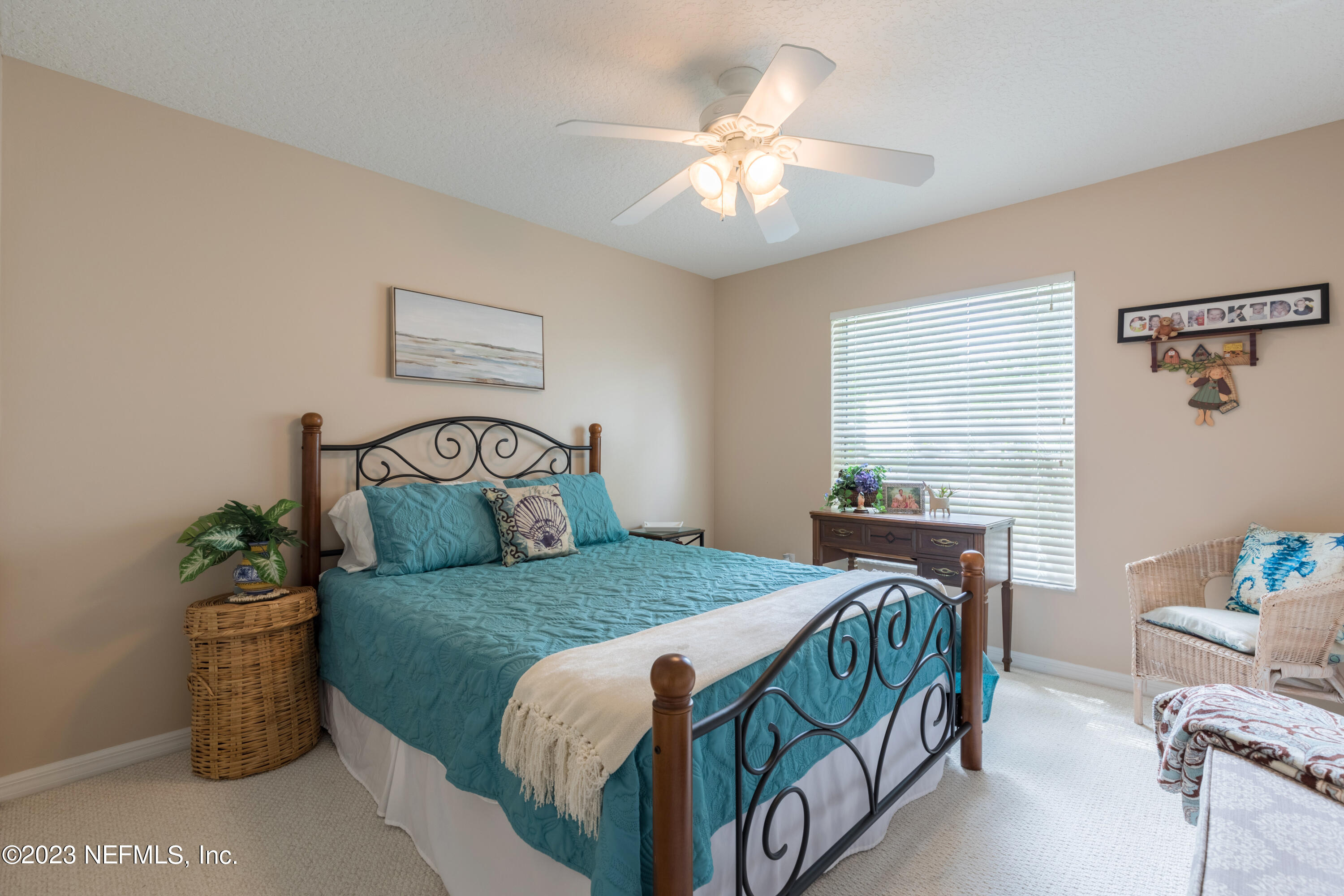 293 San Nicolas Way St. Augustine, FL 32080 - Photo 37 of 51 a bedroom with a bed and a chandelier