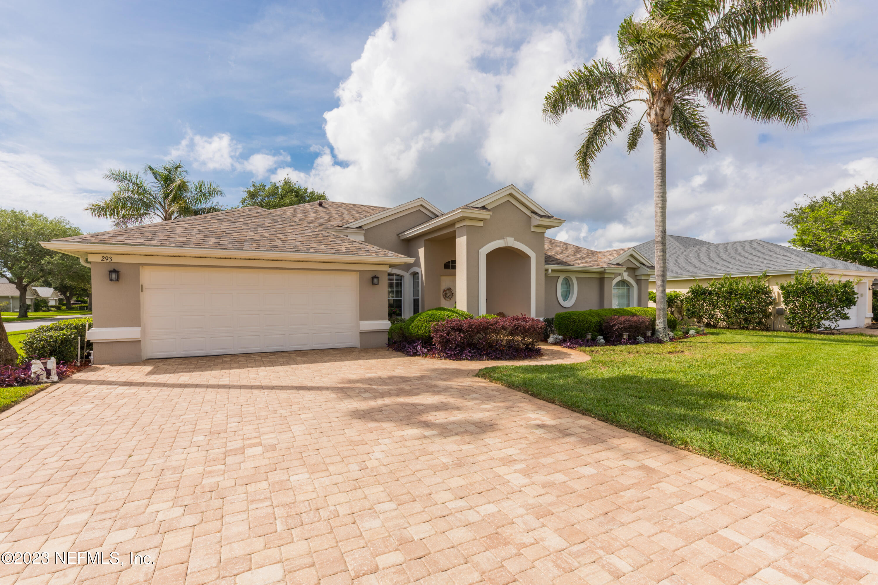 293 San Nicolas Way St. Augustine, FL 32080 - Photo 41 of 51 a front view of a house with a garden and yard