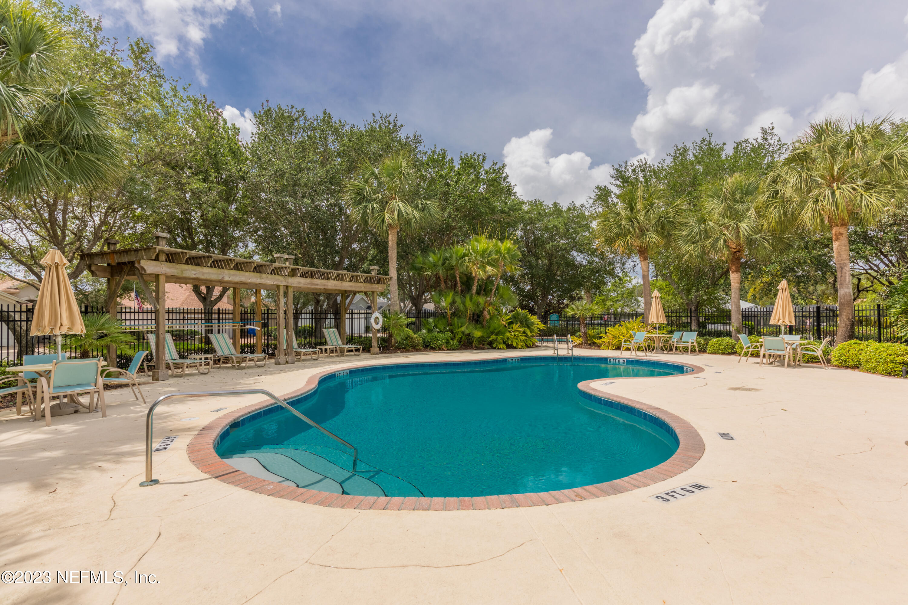 293 San Nicolas Way St. Augustine, FL 32080 - Photo 45 of 51 a view of a swimming pool with outdoor seating