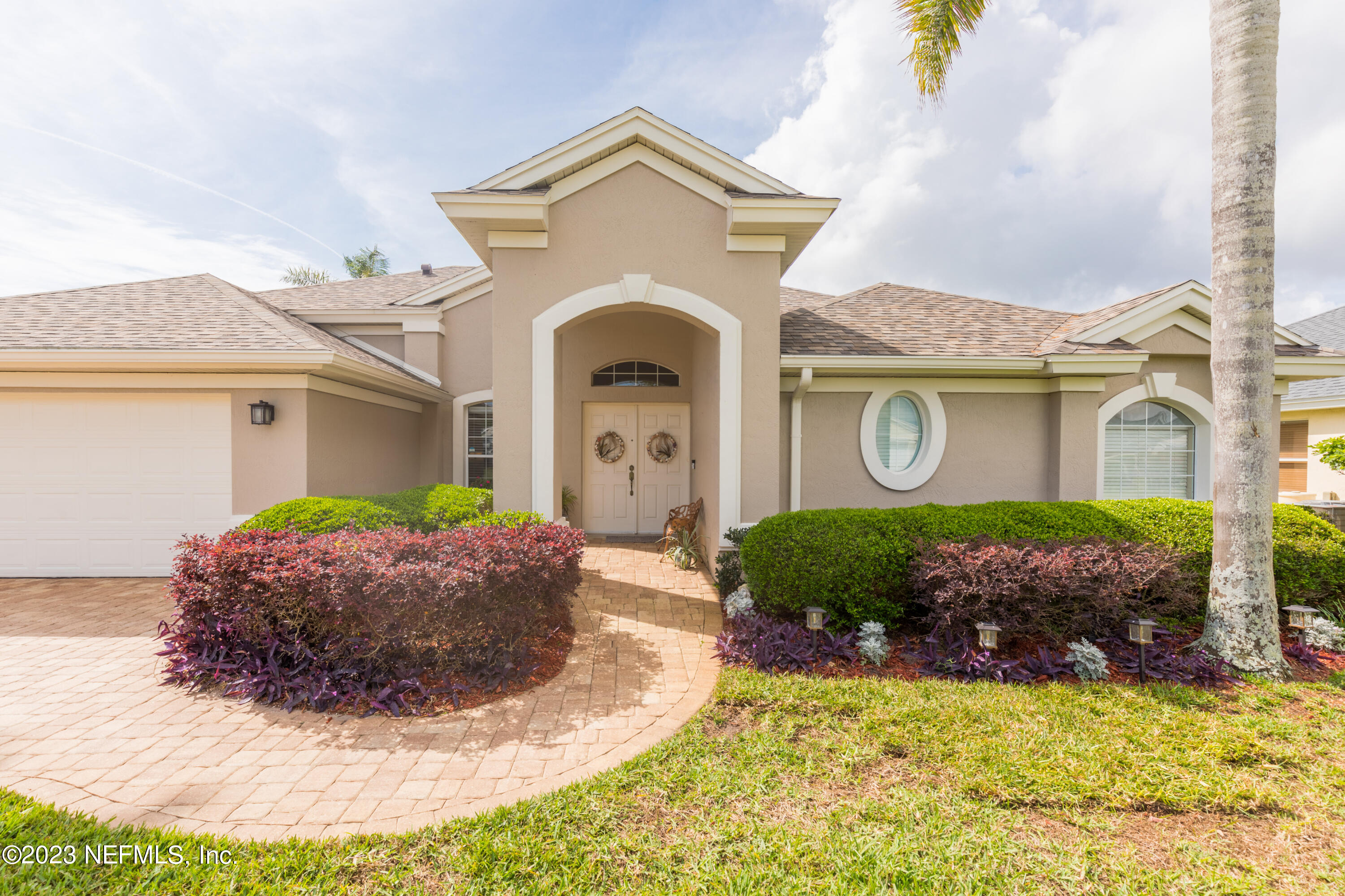 293 San Nicolas Way St. Augustine, FL 32080 - Photo 6 of 51 a front view of a house with a garden