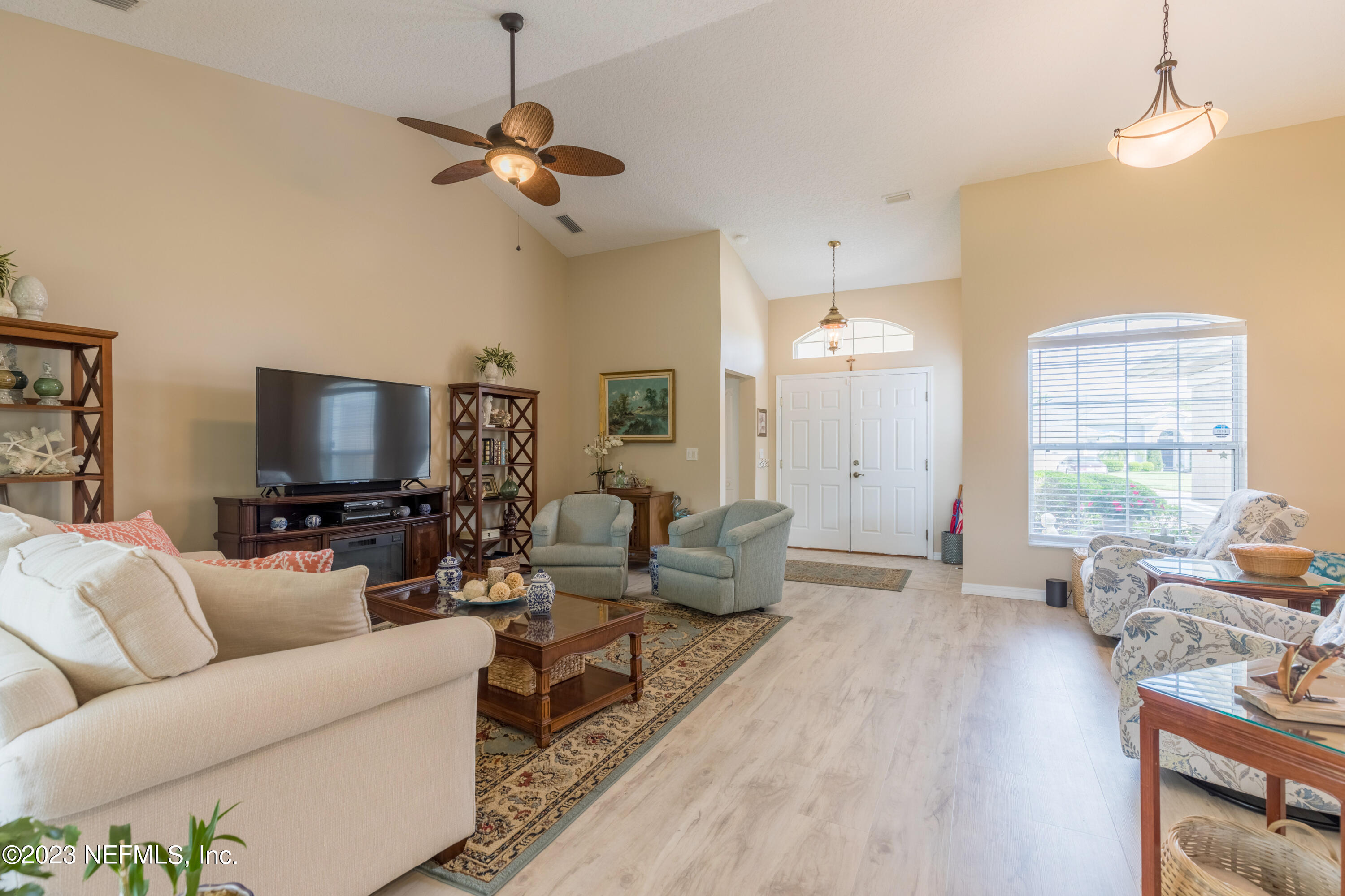 293 San Nicolas Way St. Augustine, FL 32080 - Photo 10 of 51 a living room with furniture and a flat screen tv
