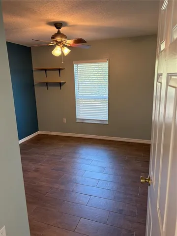 a bathroom with a shower a toilet and a sink