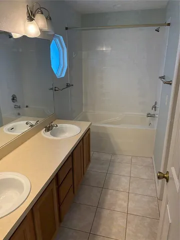 a bathroom with a toilet sink and shower