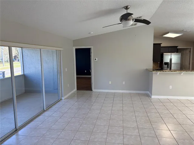 a view of a kitchen with a sink and a window