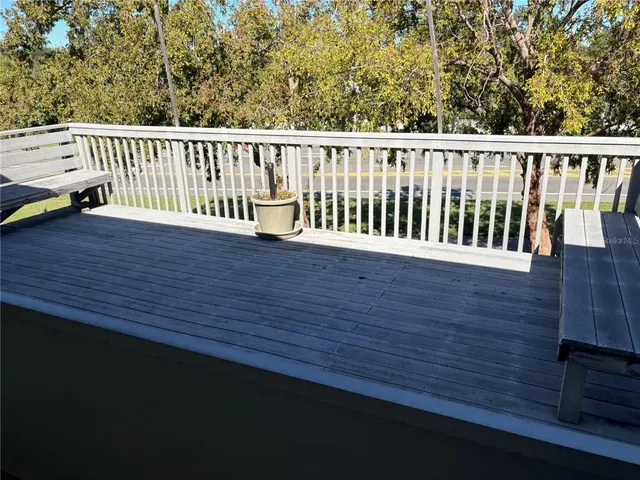 a room with pool table and windows