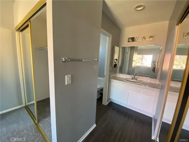 a bathroom with a sink a mirror and a shower