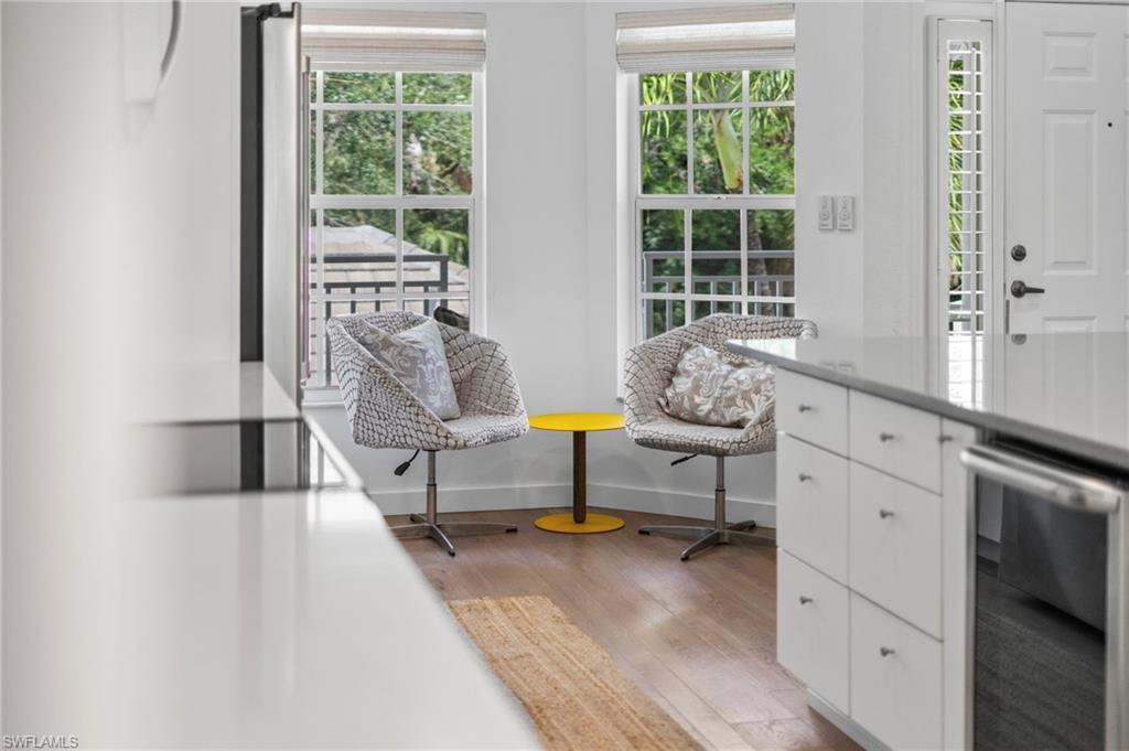 1970 Willow Bend Circle, Unit 203 Naples, FL 34109 - Photo 6 of 42 a living room with furniture and a window