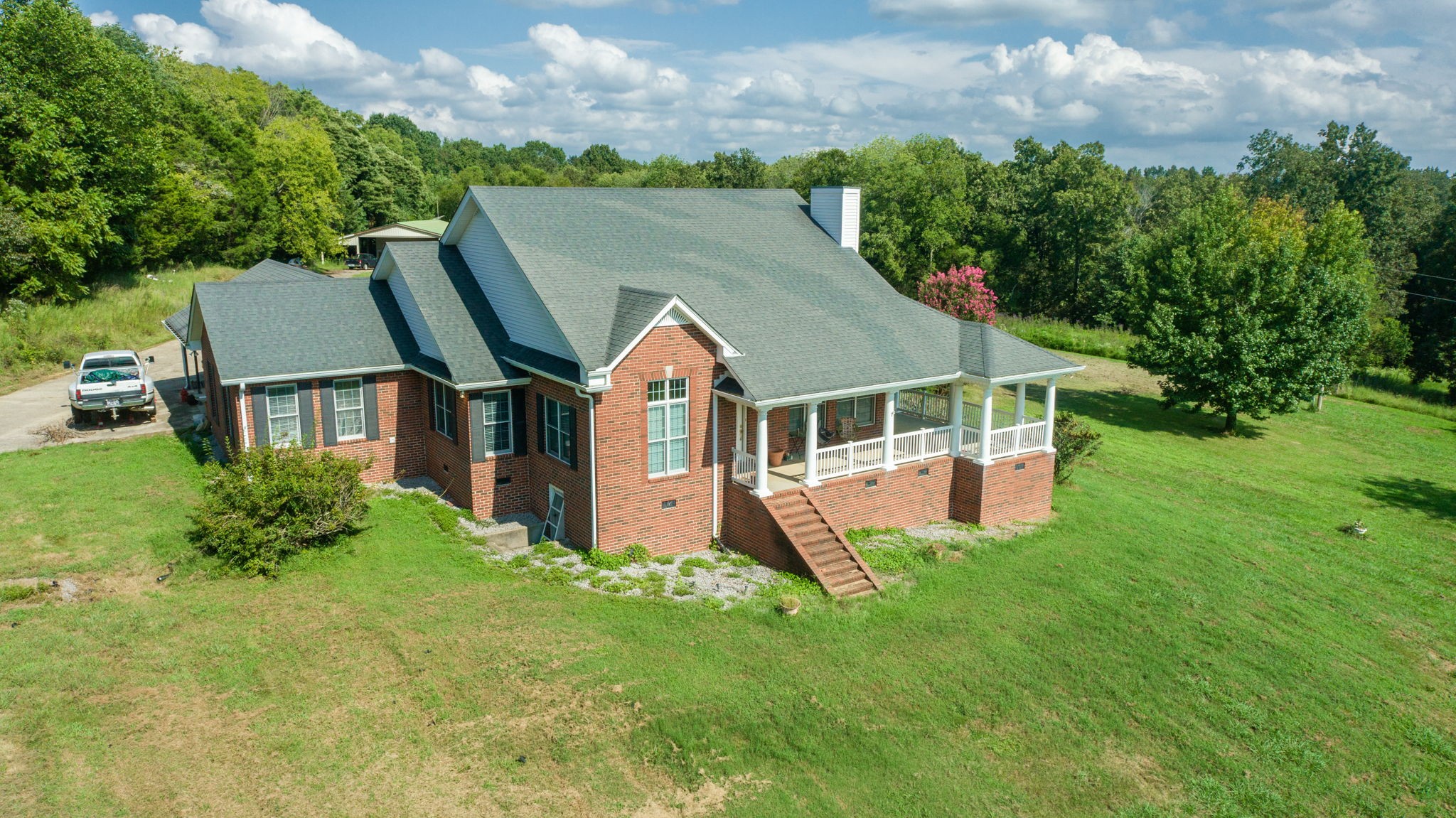 1985 Linwood Road Watertown, TN 37184 - Photo 1 of 57 a aerial view of a house next to a big yard and large trees