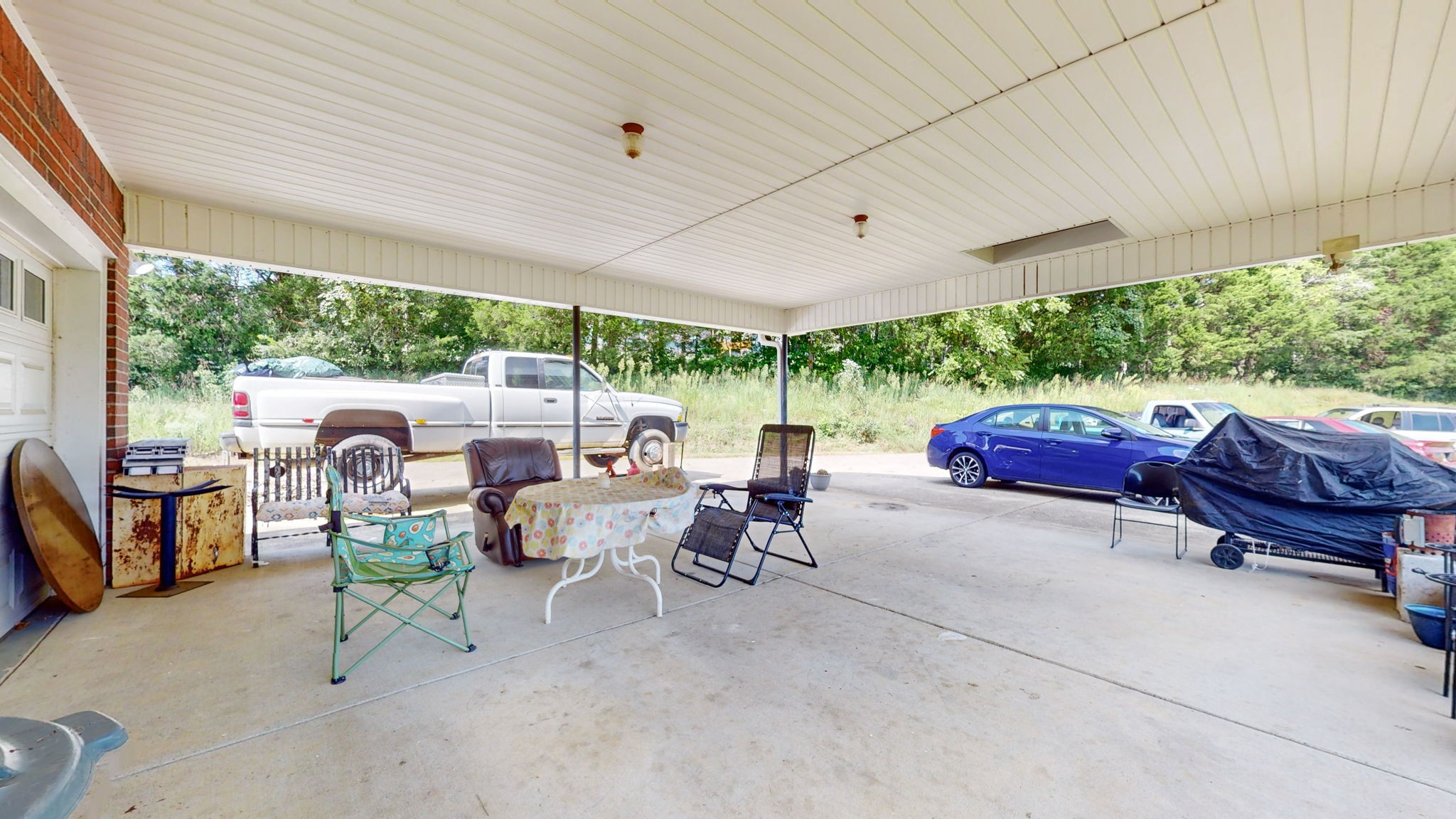 1985 Linwood Road Watertown, TN 37184 - Photo 13 of 57 a living room with patio furniture and a garden