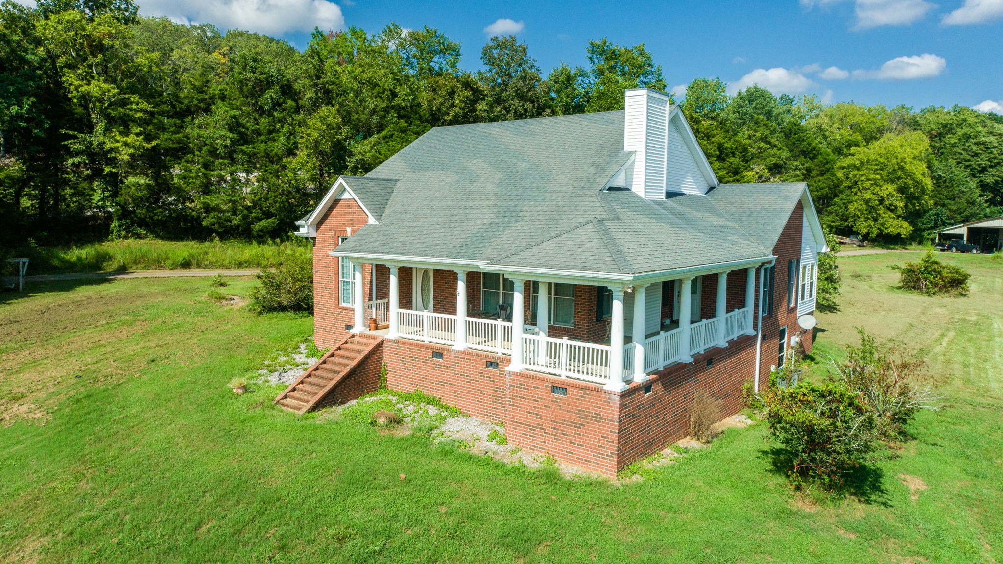 1985 Linwood Road Watertown, TN 37184 - Photo 16 of 57 aerial view of a house with a yard patio and fire pit