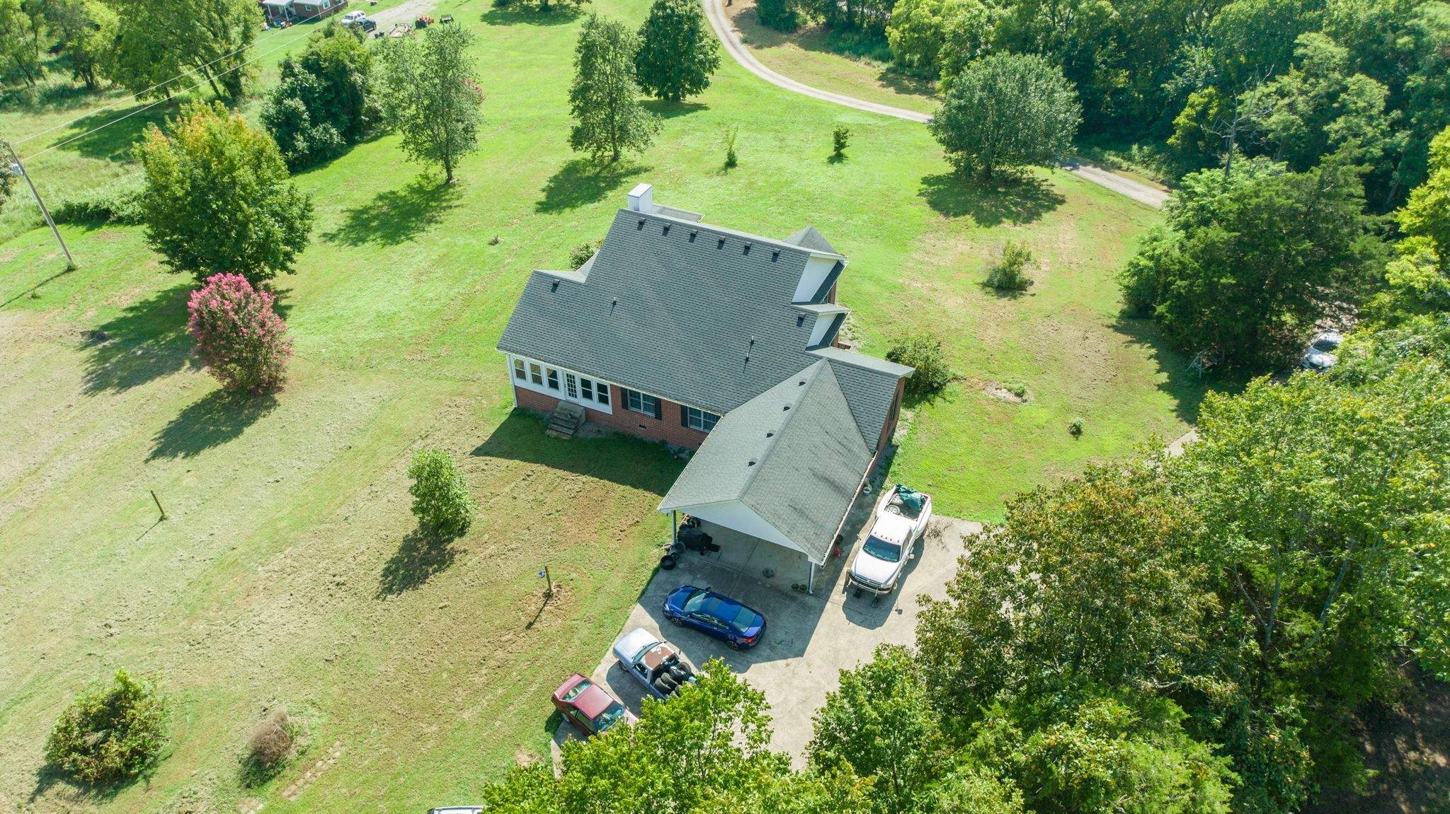 1985 Linwood Road Watertown, TN 37184 - Photo 20 of 57 an aerial view of a house with a yard and trees all around