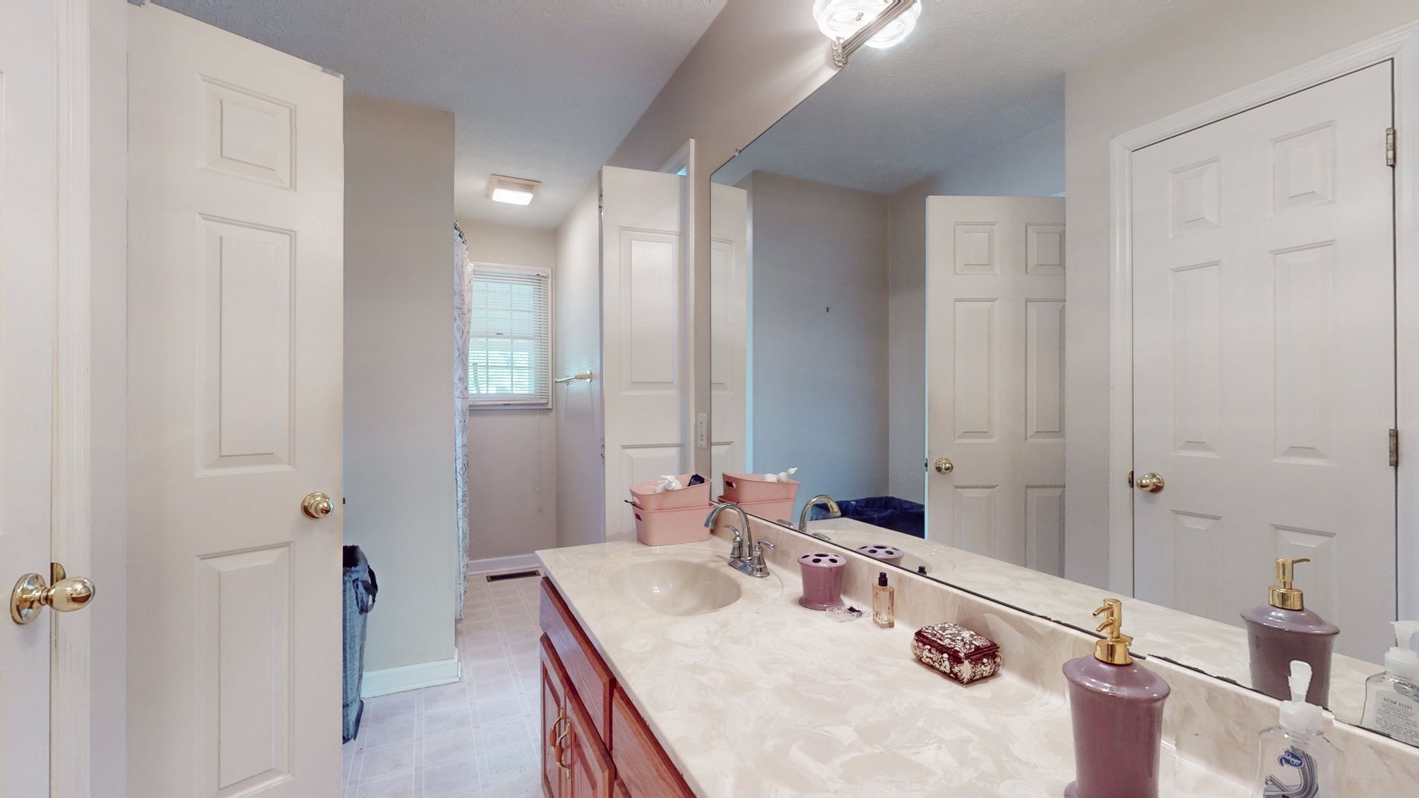 1985 Linwood Road Watertown, TN 37184 - Photo 49 of 57 a bathroom with a granite countertop sink a mirror and a shower