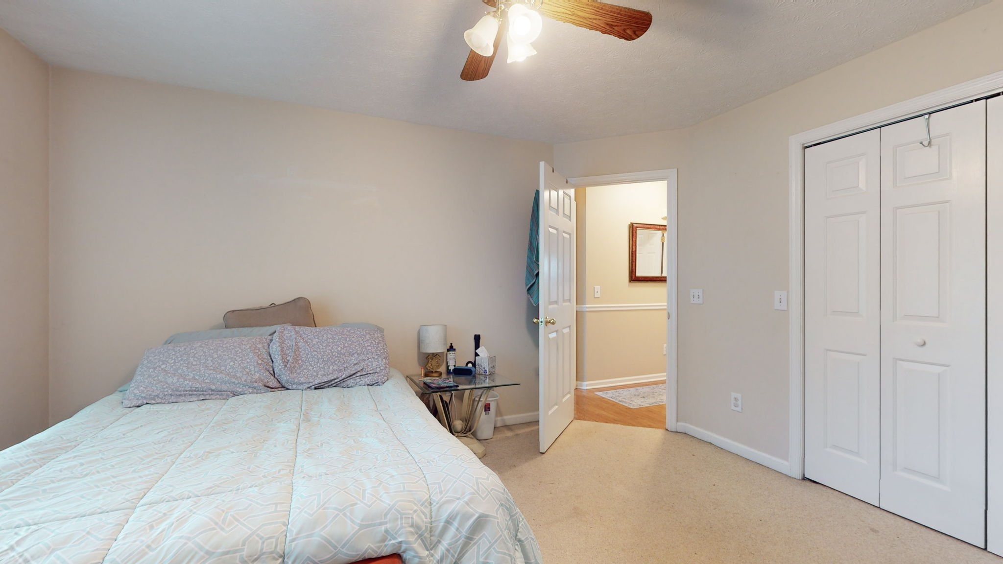 1985 Linwood Road Watertown, TN 37184 - Photo 56 of 57 a bedroom with a bed and a chandelier