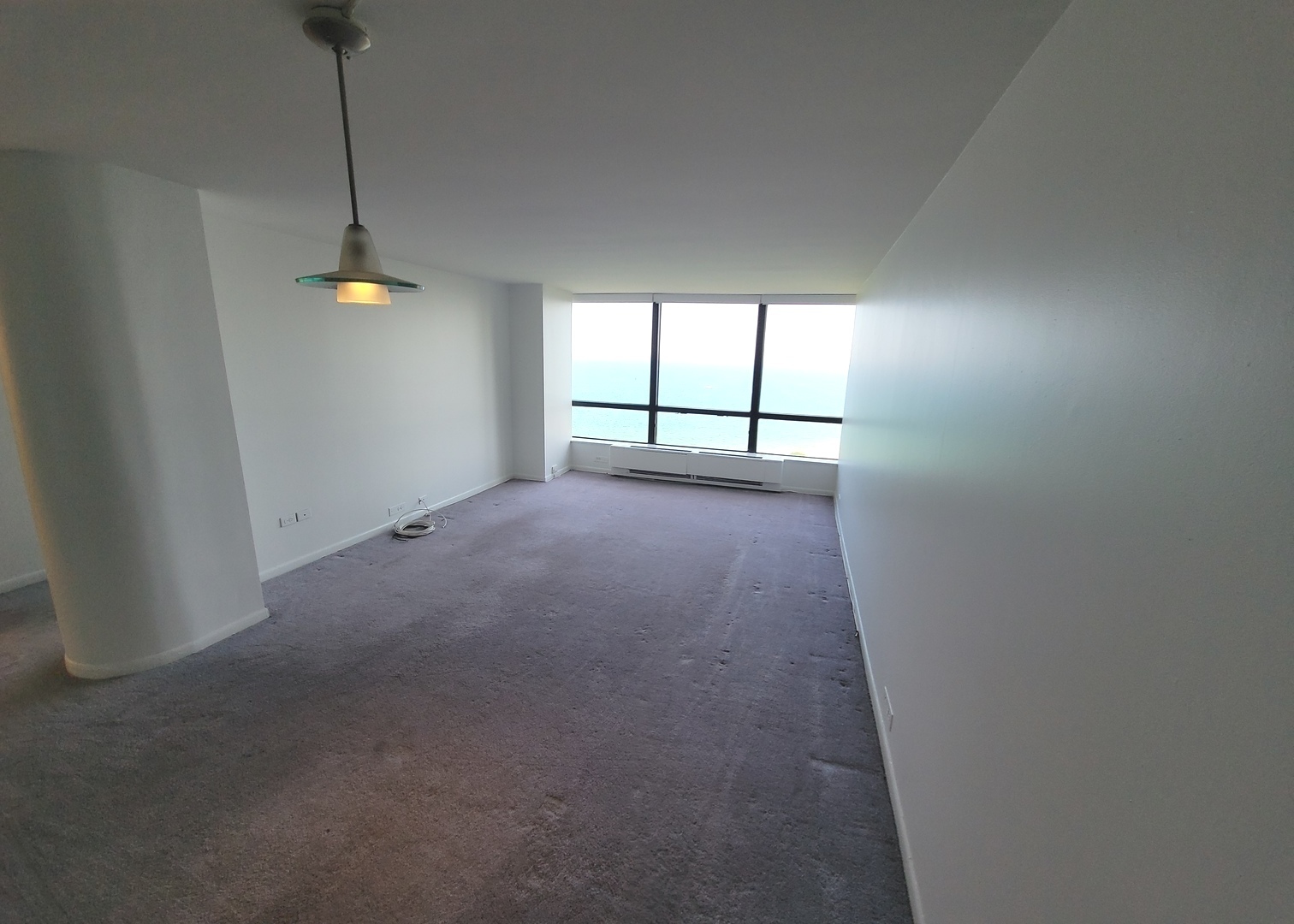 5415 North Sheridan Road, Unit 2805 Chicago, IL 60640 - Photo 5 of 23 a view of empty room with windows