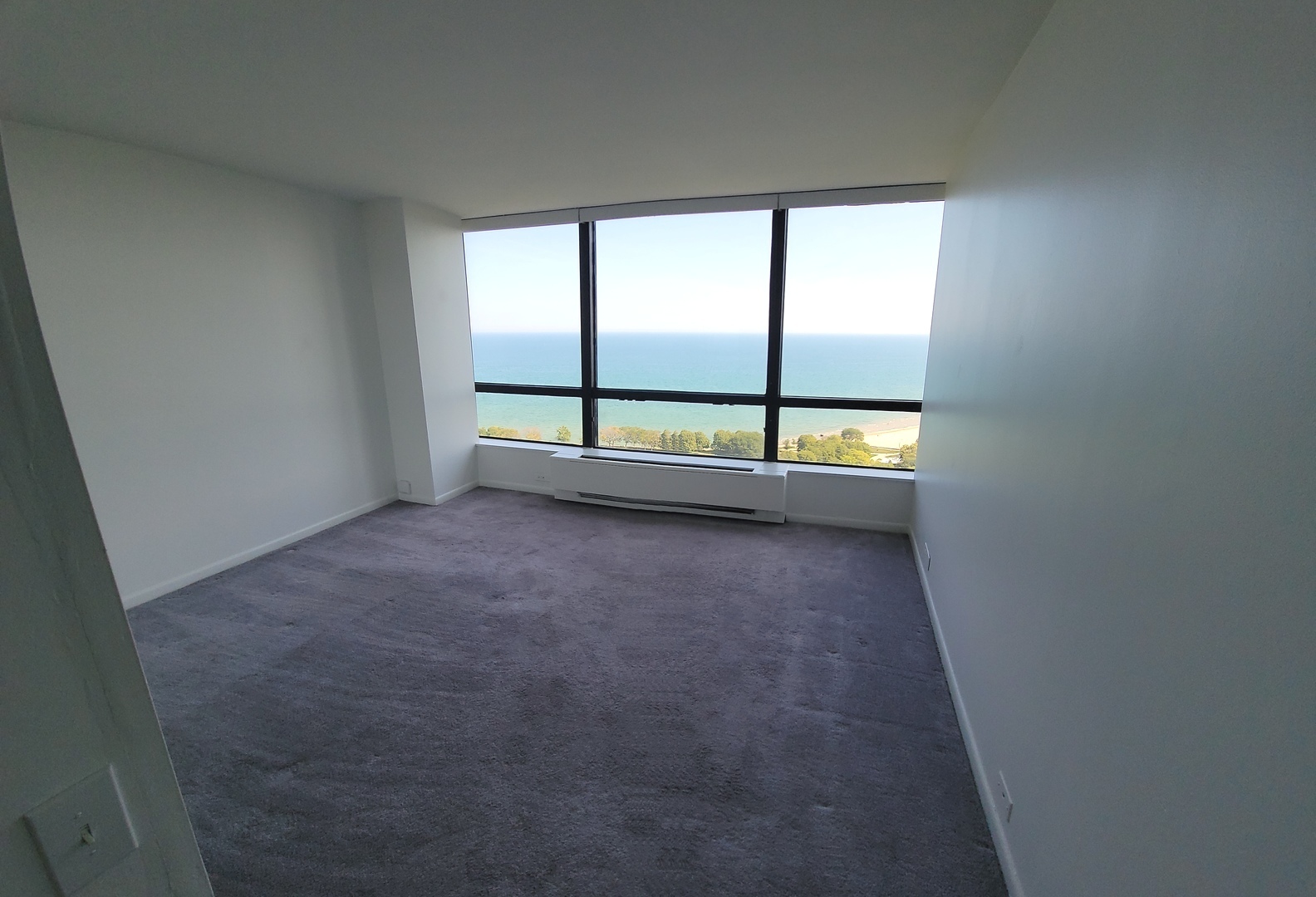 5415 North Sheridan Road, Unit 2805 Chicago, IL 60640 - Photo 9 of 23 an empty room with sliding door